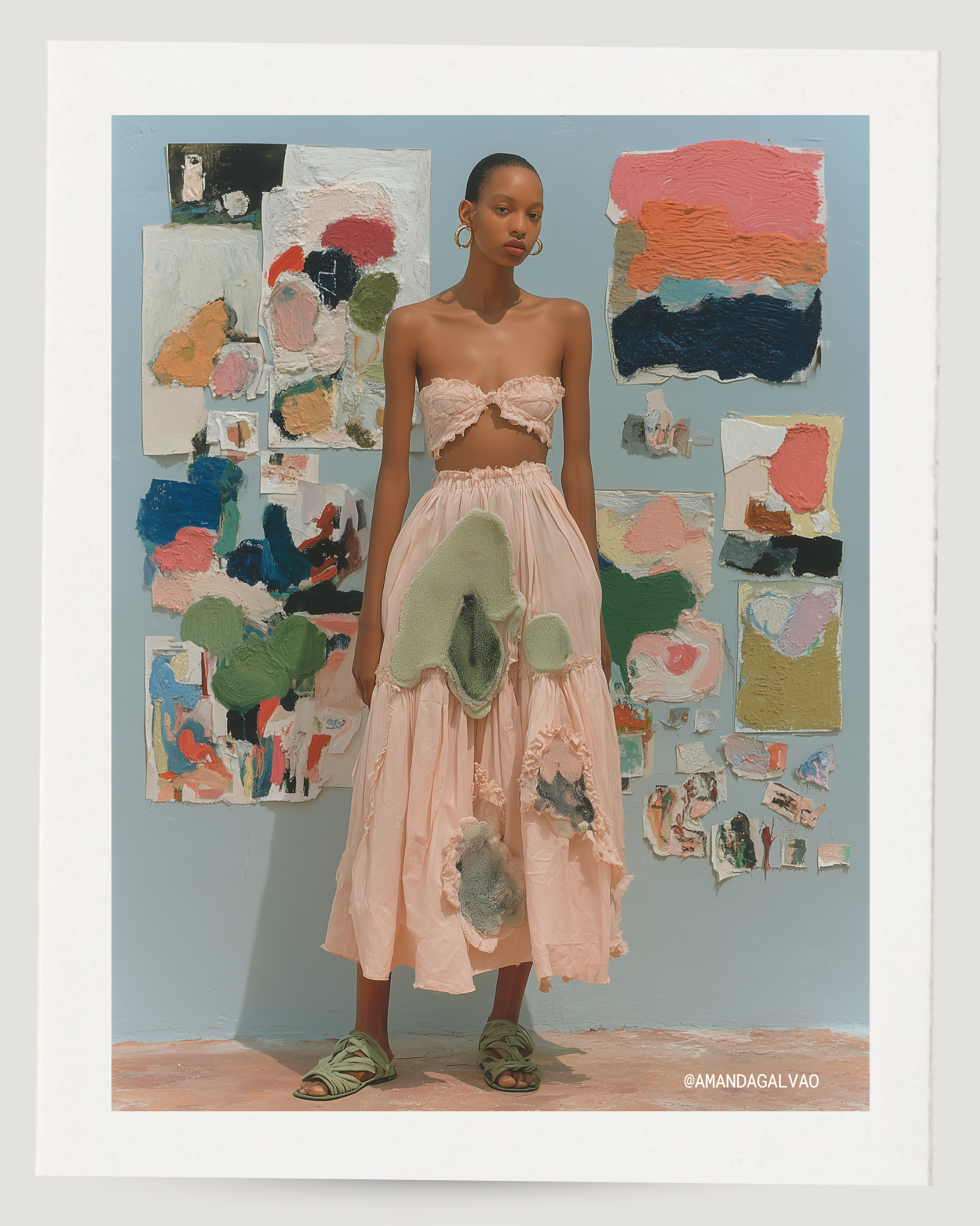 A woman standing in front of an abstract art display on a wall, wearing pastel pink clothing with textured patches, and green sandals.