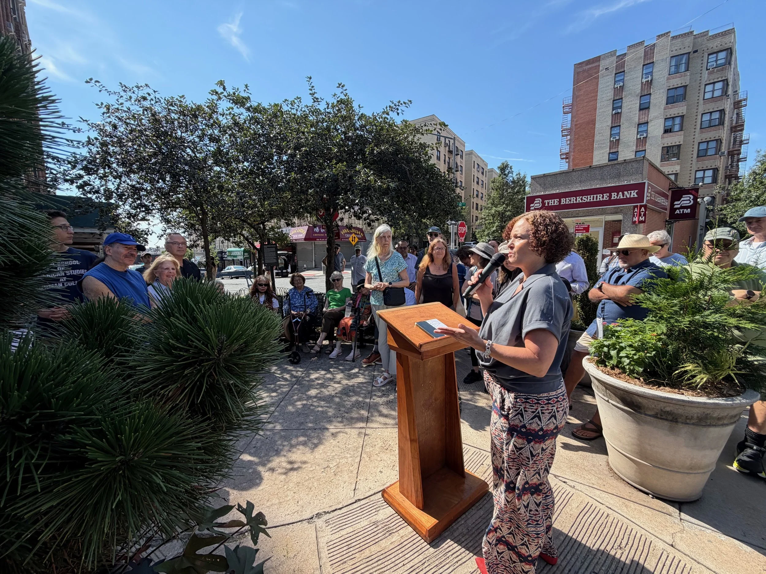 Jana LaSorte, Northern Manhattan Parks Administrator and Ceremony Emcee, welcoming the gathering to celebrate the 25th Anniversary of The Paterno Trivium and the anniversary of the 8/4/1878 birthdate of Dr. Charles V. Paterno.