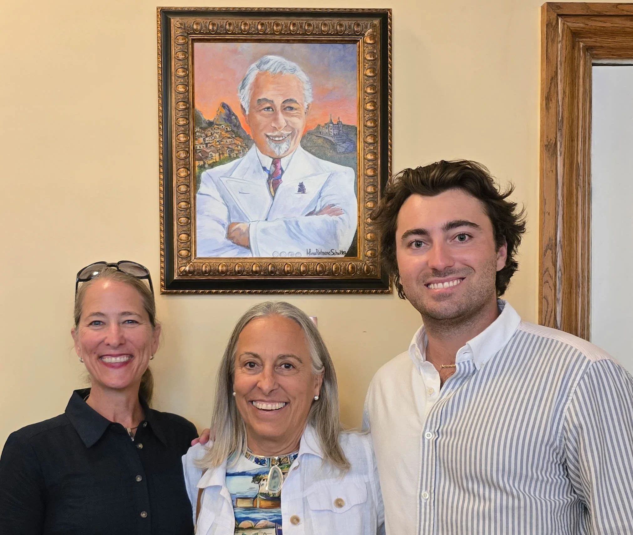 (l-r) Carla Cappiello Golden and Elizabeth Barratt-Brown (great-granddaughters) and Barratt Dewey, (great-great grandson), under the portrait of Dr. Charles V. Paterno during the reception held in the HVG Lounge.                                      