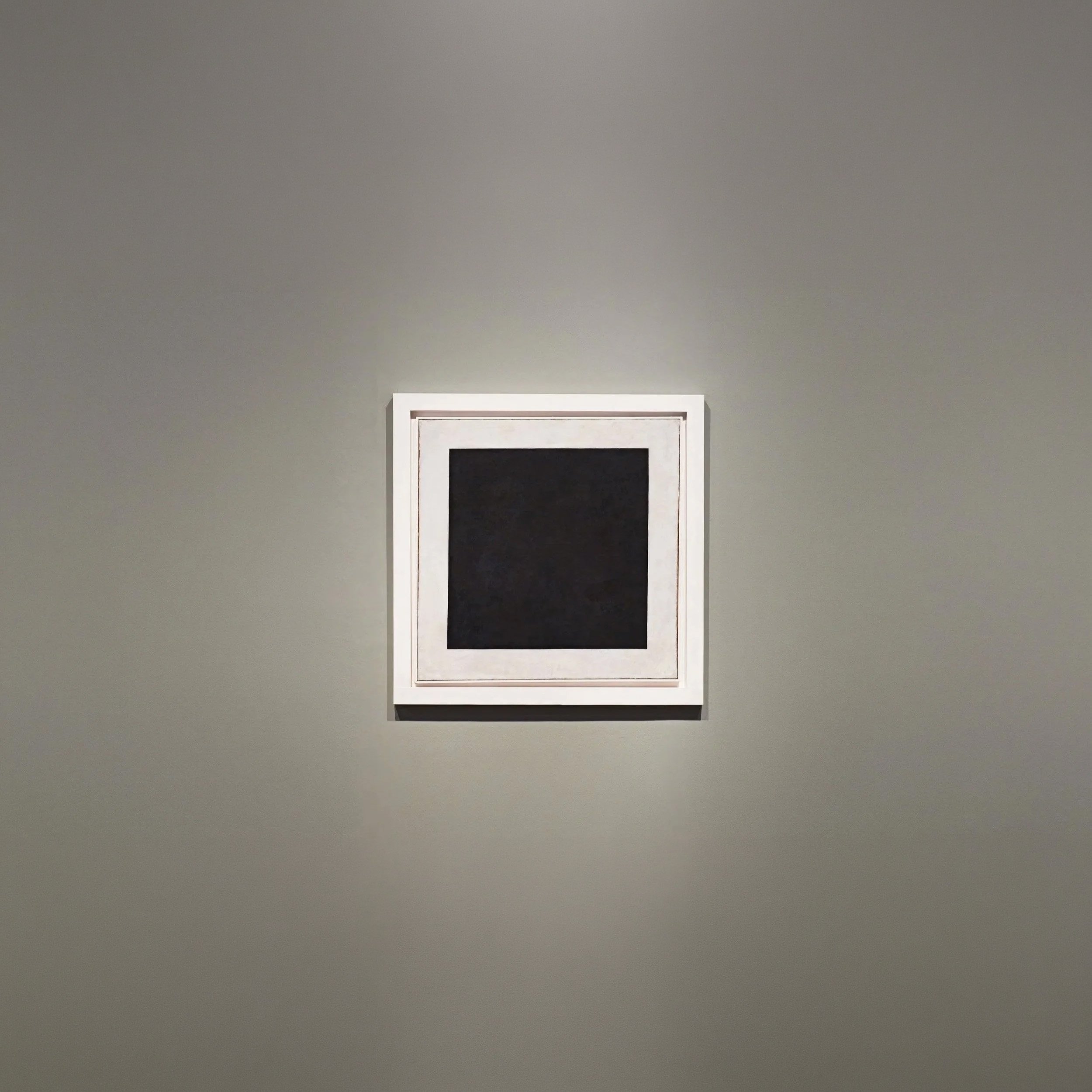 Even, a black square floats in a void of light, creating a pure contrast where matter inhabits the intangible.

Kazimir Malevich, Black Square, 1915.