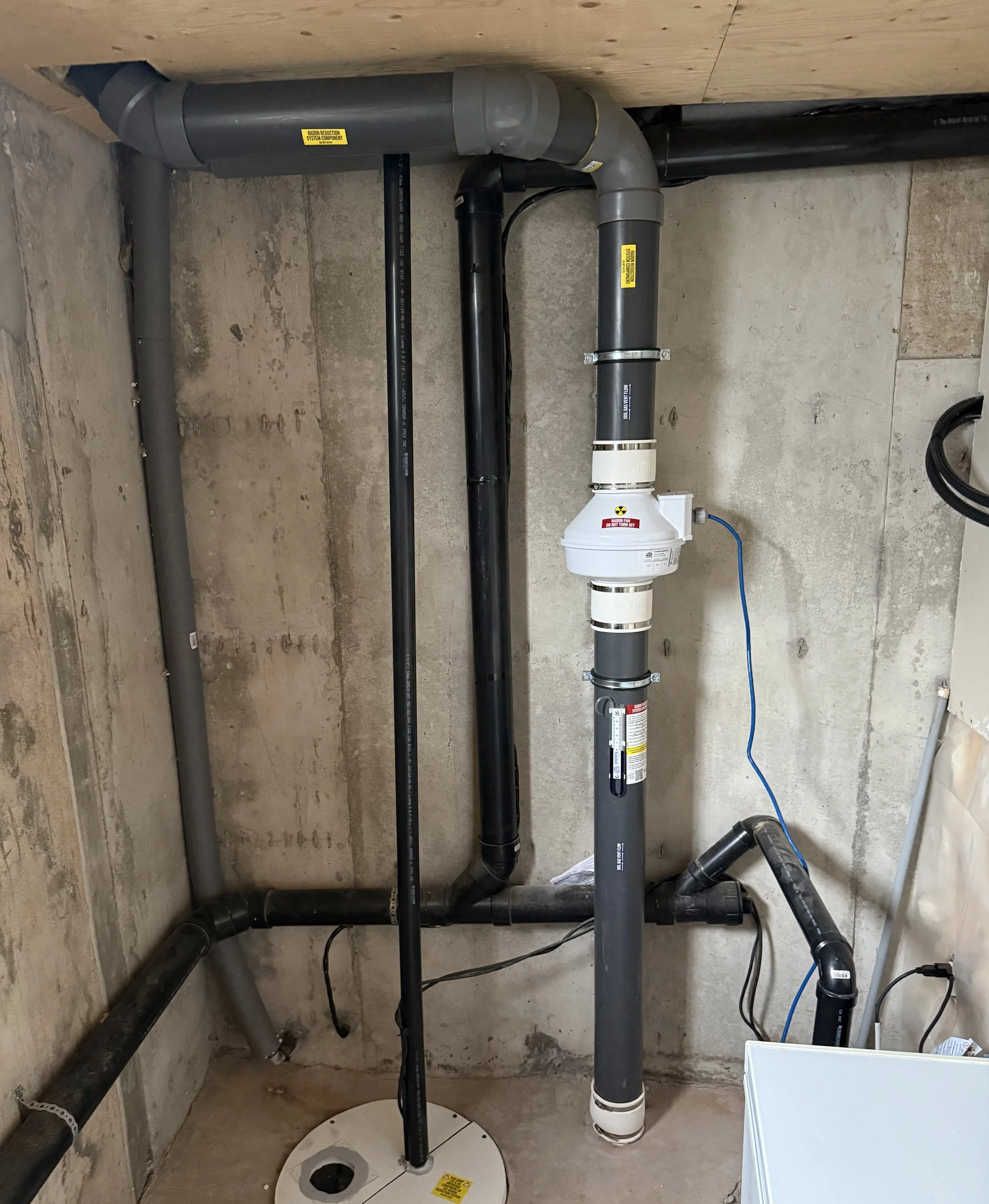 Residential radon mitigation system.  Sealed sump lid, radon system with radon x pipe, fantech radon exhaust fan, CGSB standards compliant, C-NRPP standard compliant.