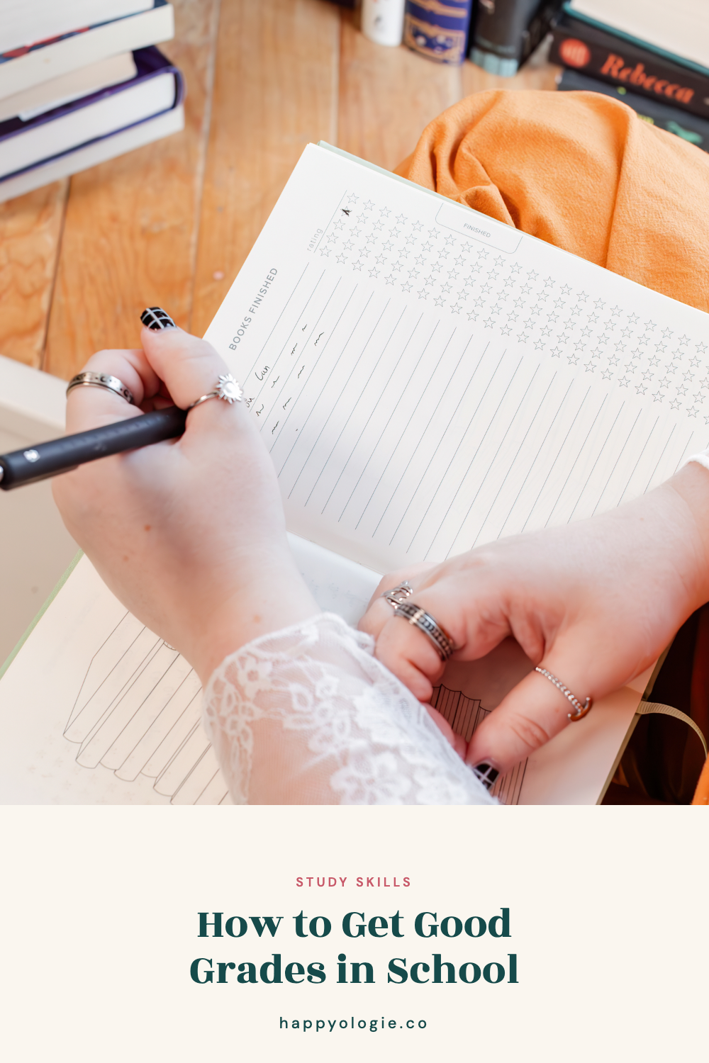 Student writing in a reading tracker with books nearby.