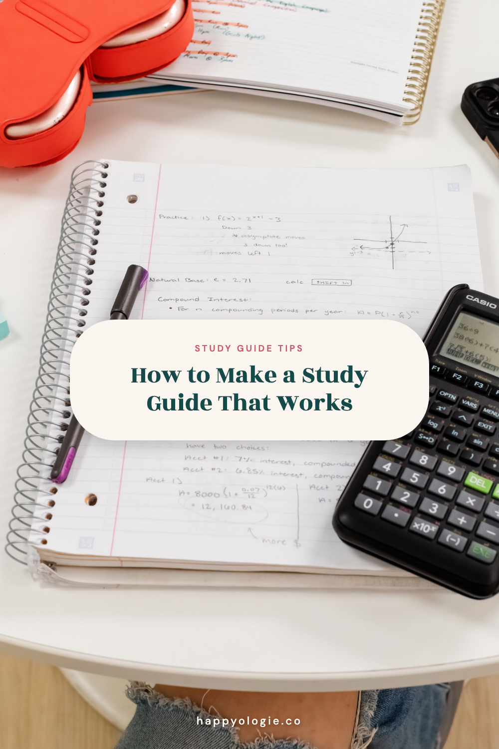 College study notes beside a calculator and pen for making a study guide.