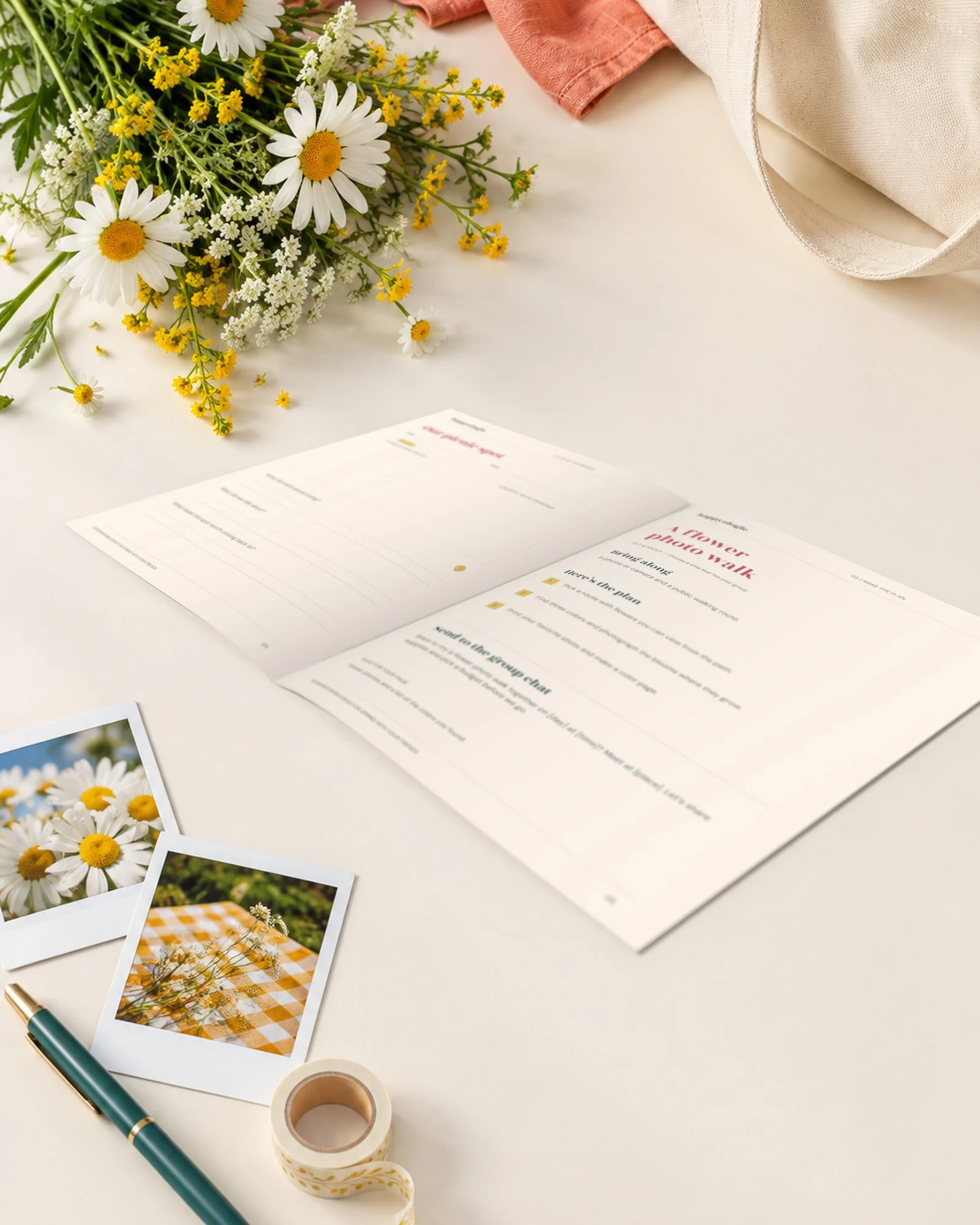 Open Spring with Friends guide beside flowers, photo prints, a pen, and washi tape on a cream table.
