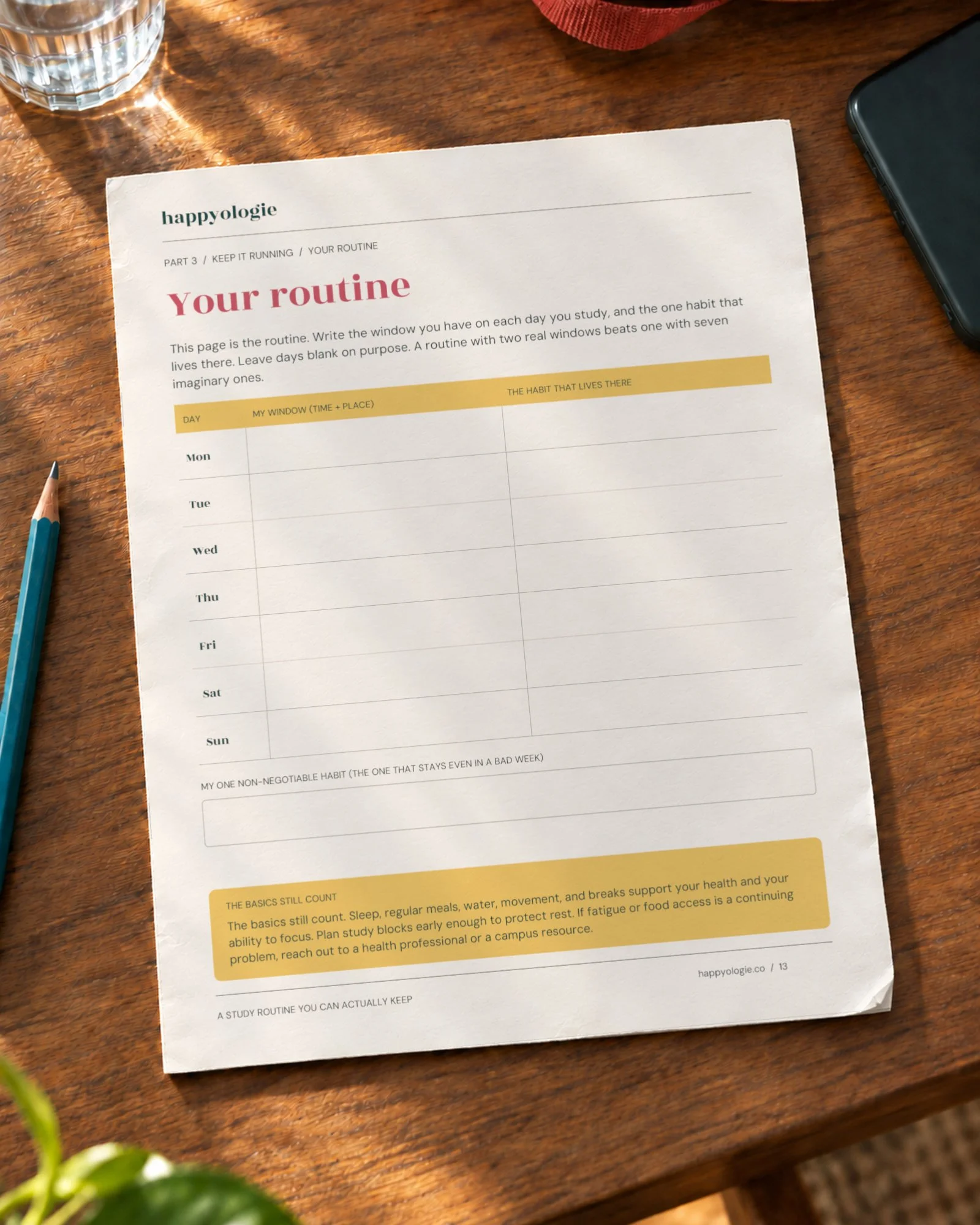 Your routine worksheet from the Study Routine guide on a wood table.