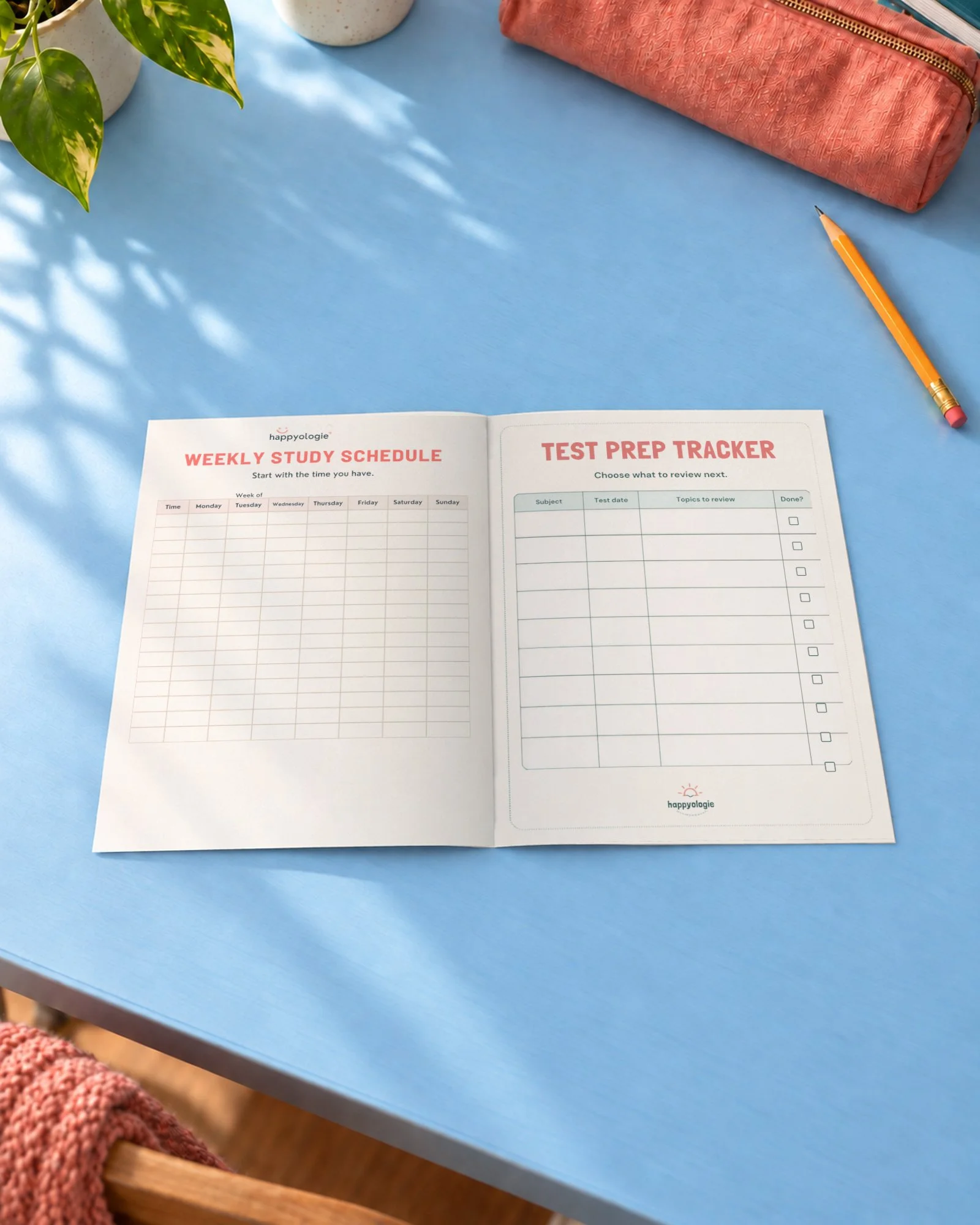 Weekly Study Schedule and Test Prep Tracker open on a blue desk.