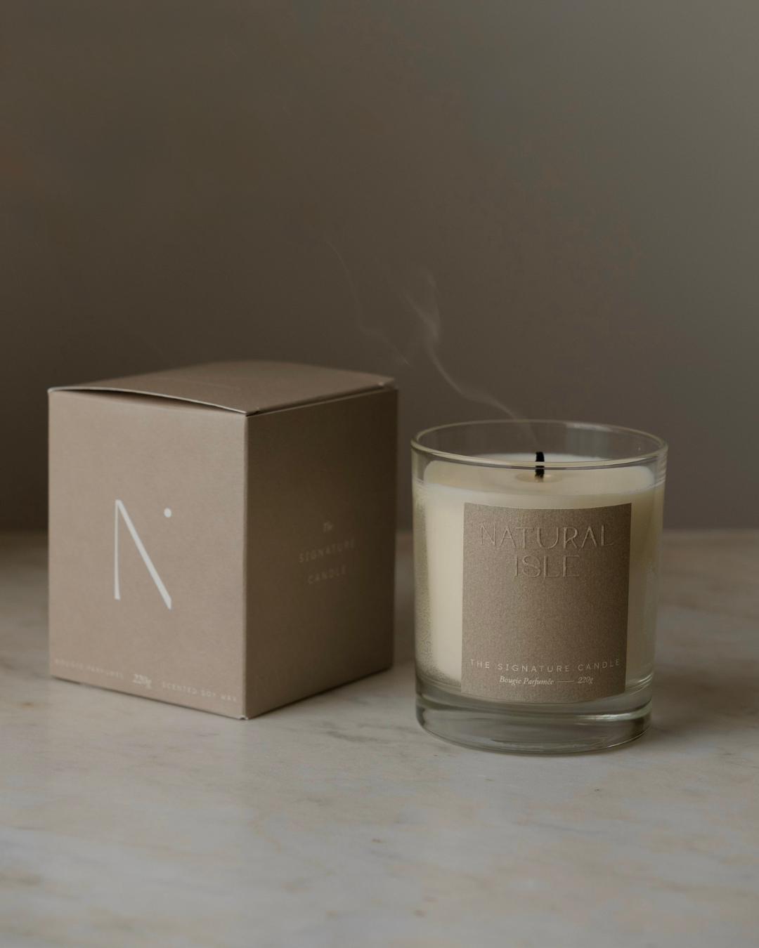 Natural Isle candle label design and branded packaging box