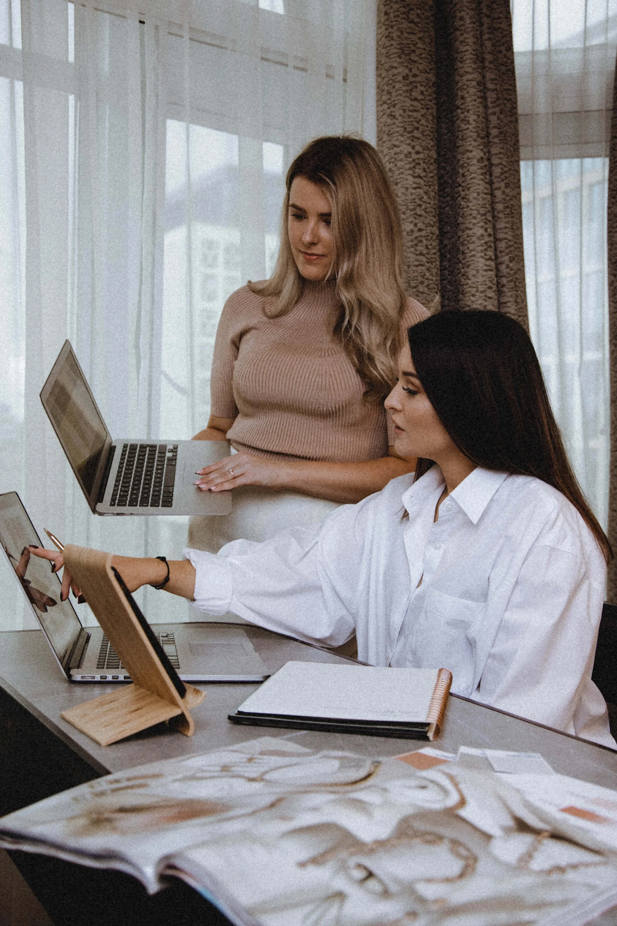 Amy Wilson and Jasmine Ward discussing a client brand strategy project