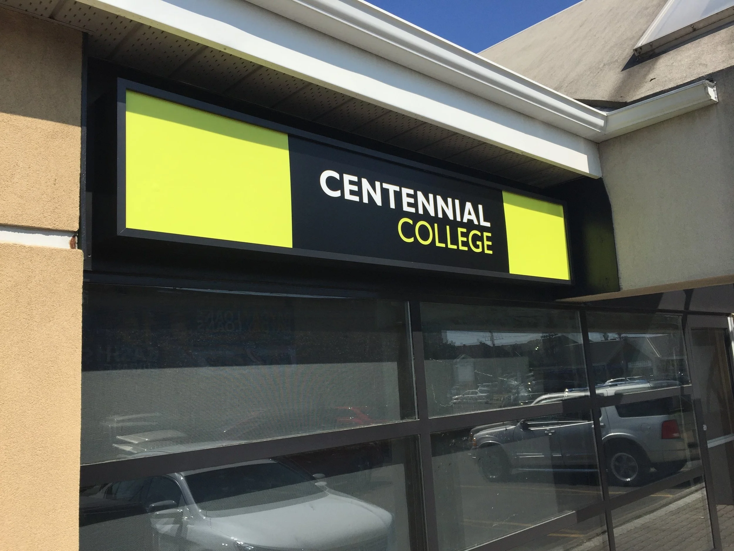 Sign for Centennial College on the building exterior.
