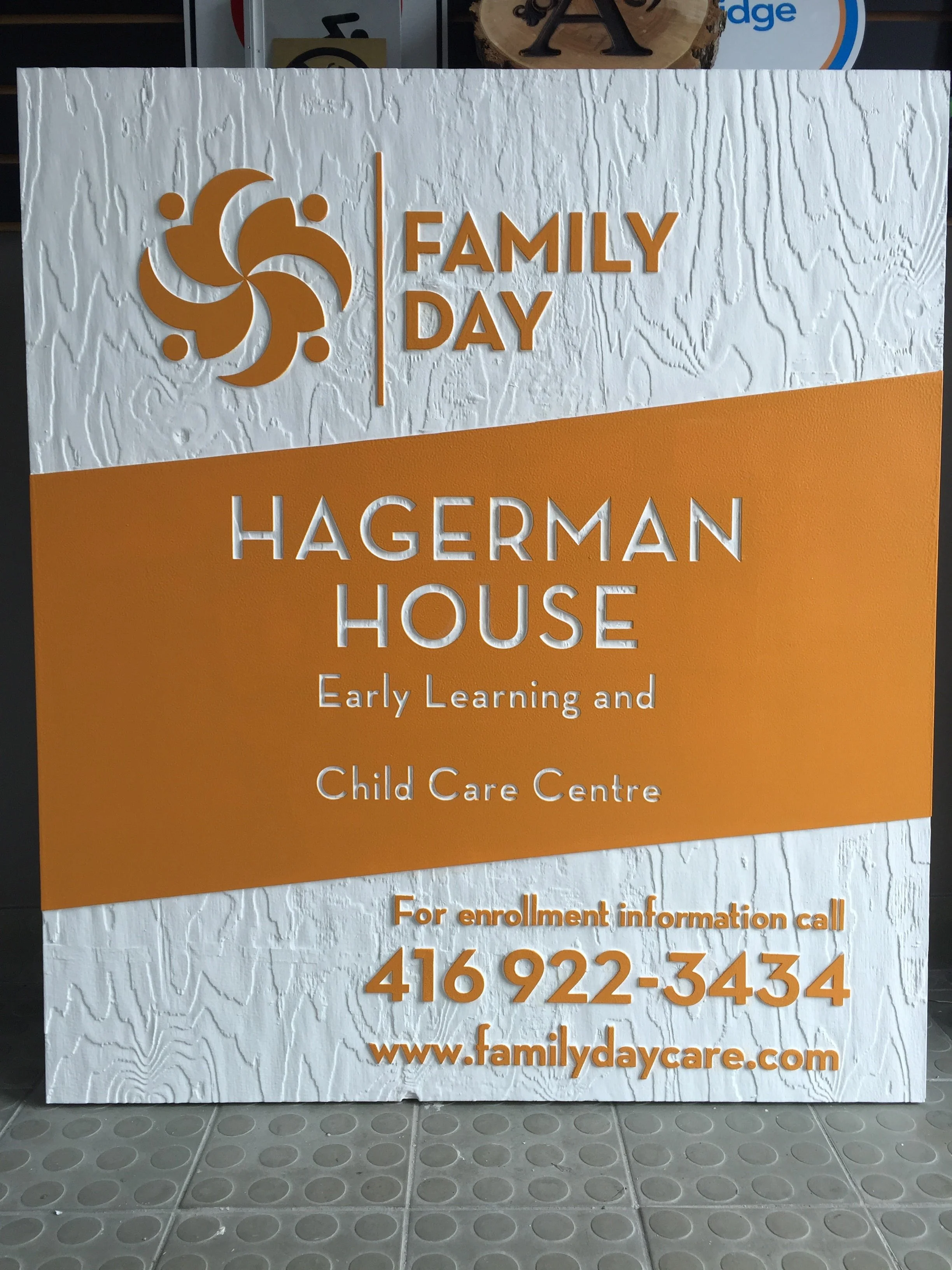 Signboard for Hagerman House Early Learning and Child Care Centre, with contact information including phone number and website.