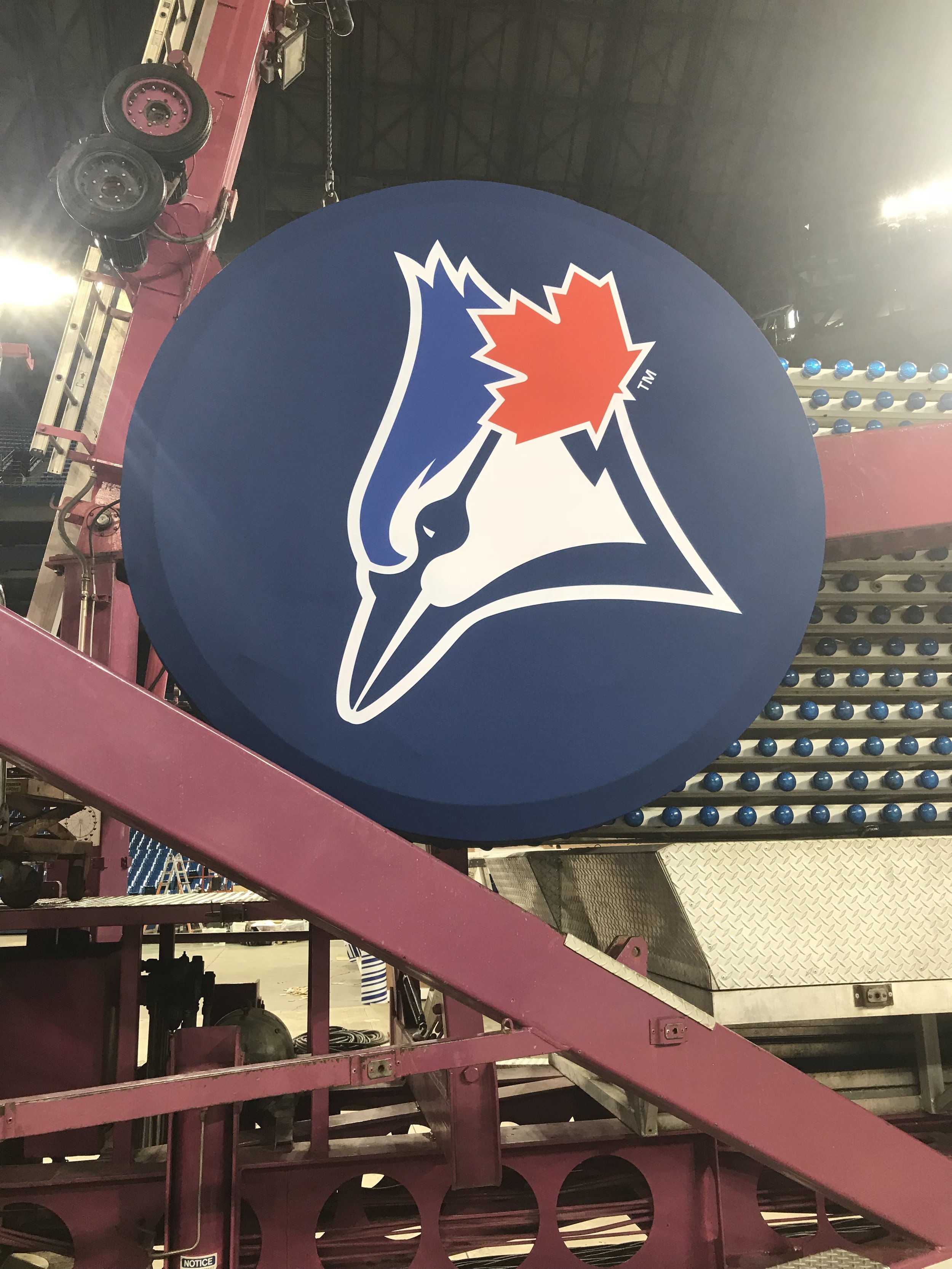 The Toronto Blue Jays logo displayed inside a baseball stadium.