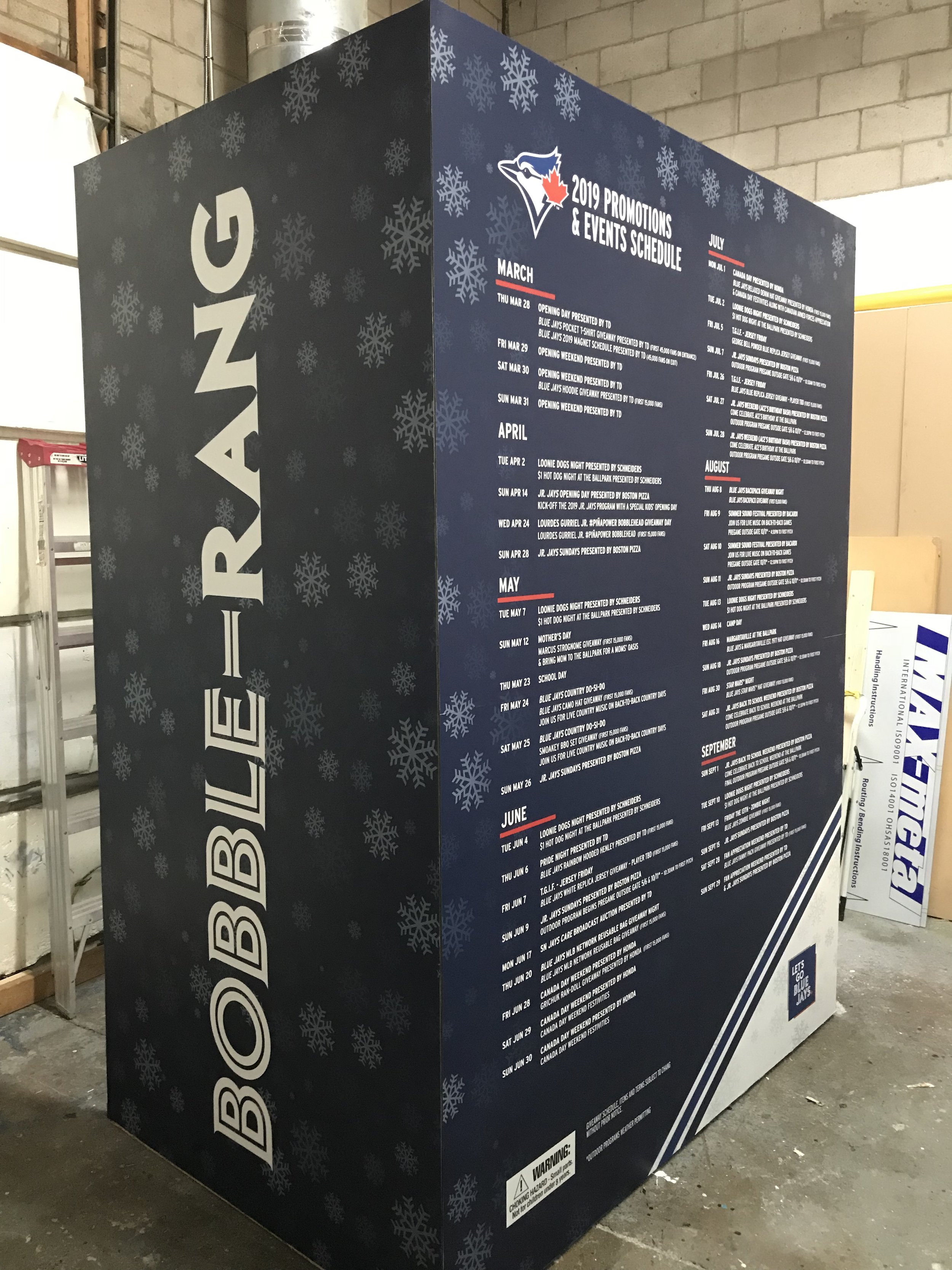 A large poster with a blue background and snowflake designs displaying the Toronto Blue Jays 2019 promotions and events schedule, including months from March to September, with various game and event details.