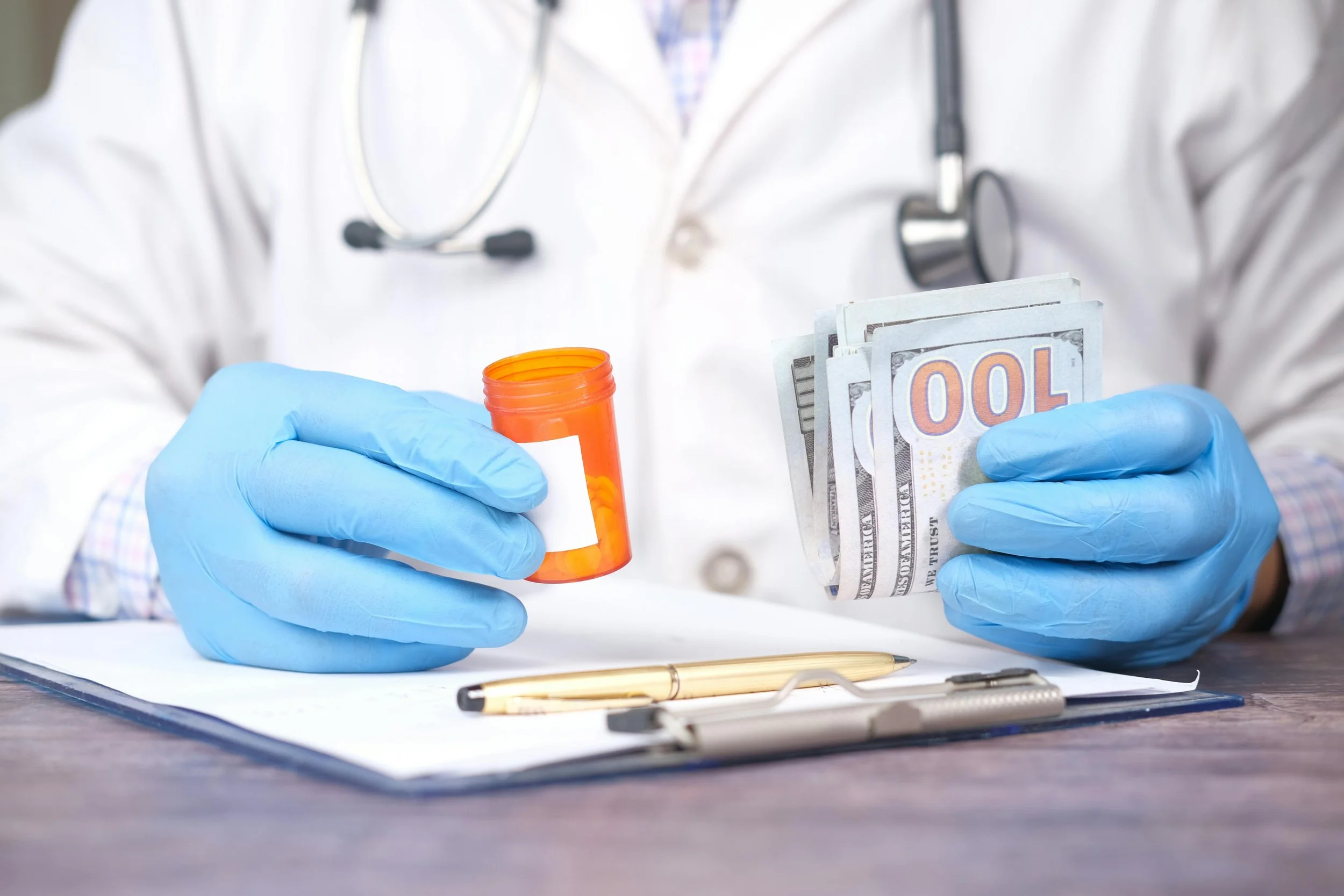 Doctor holding an empty prescription pill bottle in one hand and several $100 bills in the other, representing the rising cost of healthcare and prescription medications in retirement.
