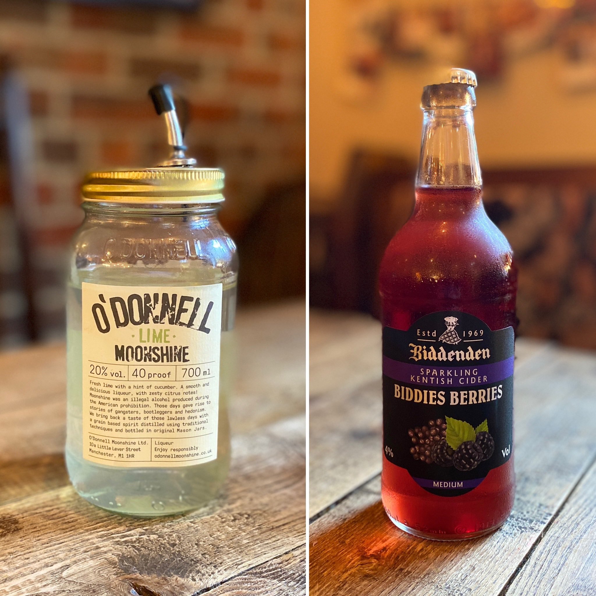 A mason jar with a metal lid and a straw contains a clear beverage, labeled Òdonnell Lime Moonshine;" a glass bottle with a screw cap is filled with red, sparkling cider labeled "Biddenden Biddies Berries Sparkling Kentish Cider" with an image of bla