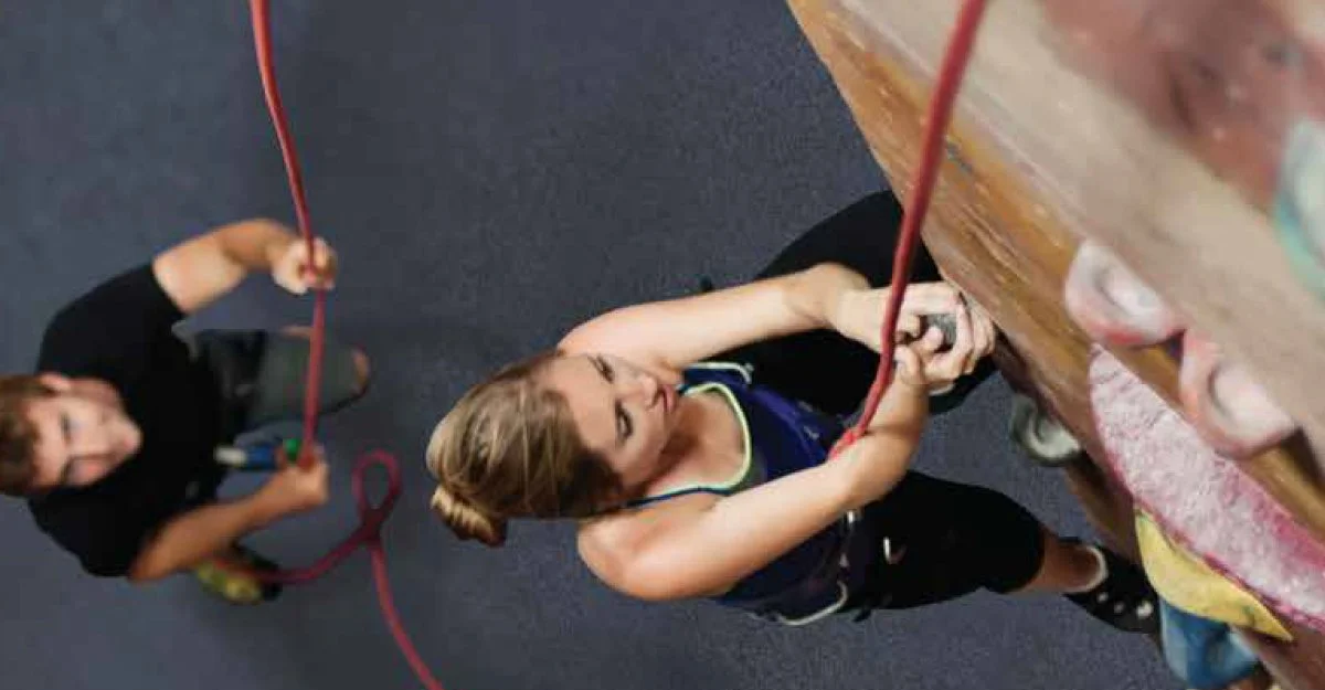 Climber and belayer climbing at Planet Rock