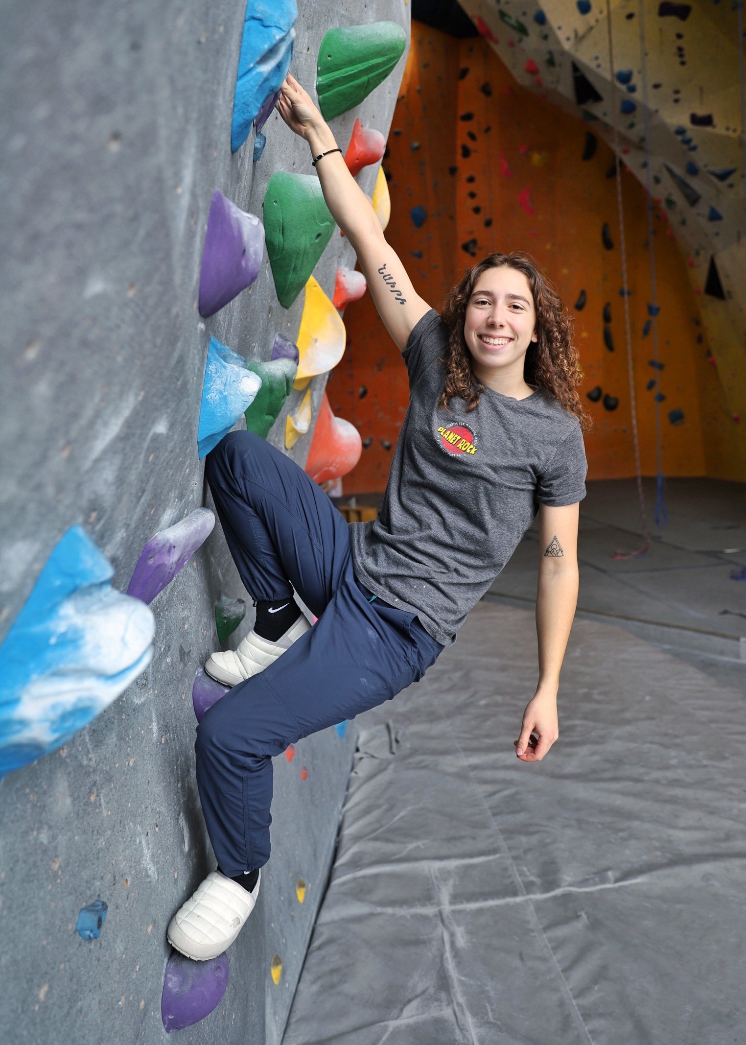 Planet Rock team member climbing bouldering wall