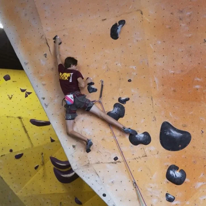 Planet Rock team member learning lead climbing