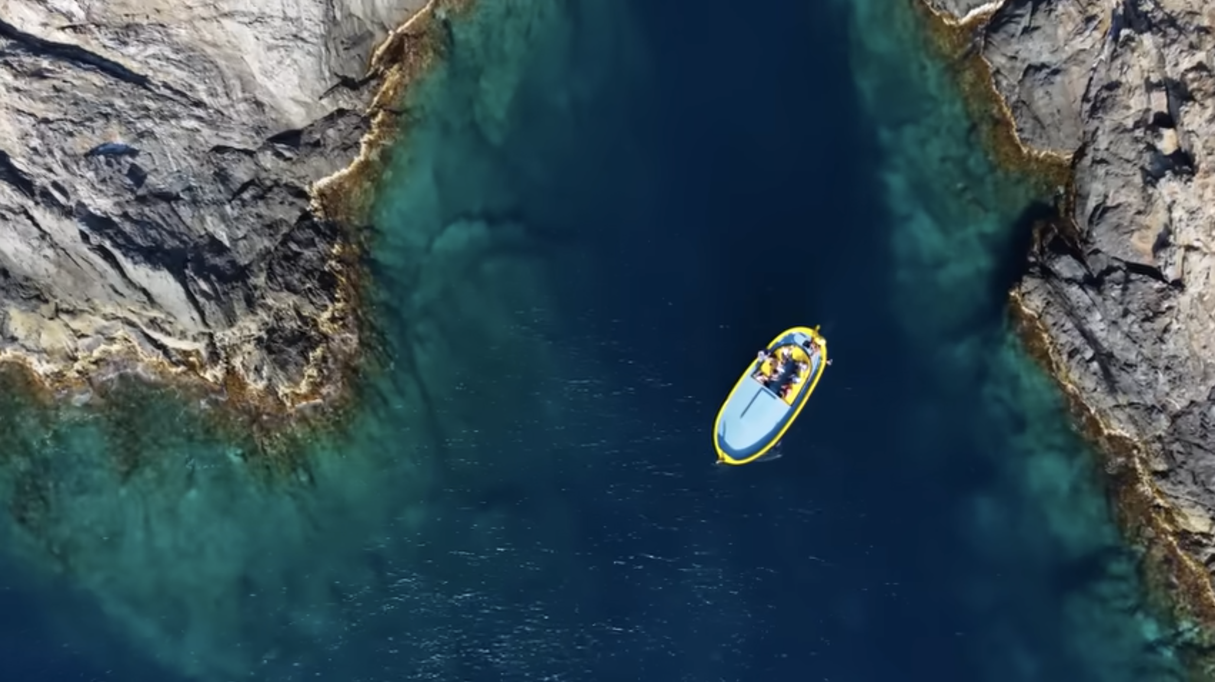 Gala boat in turquoise waters of Cap de Creus near Cadaqués