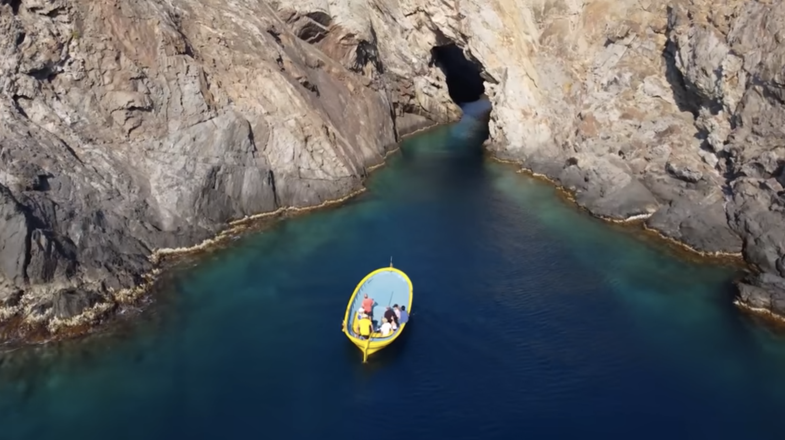 Private boat in rocky cove of Cap de Creus Natural Park near Cadaqués