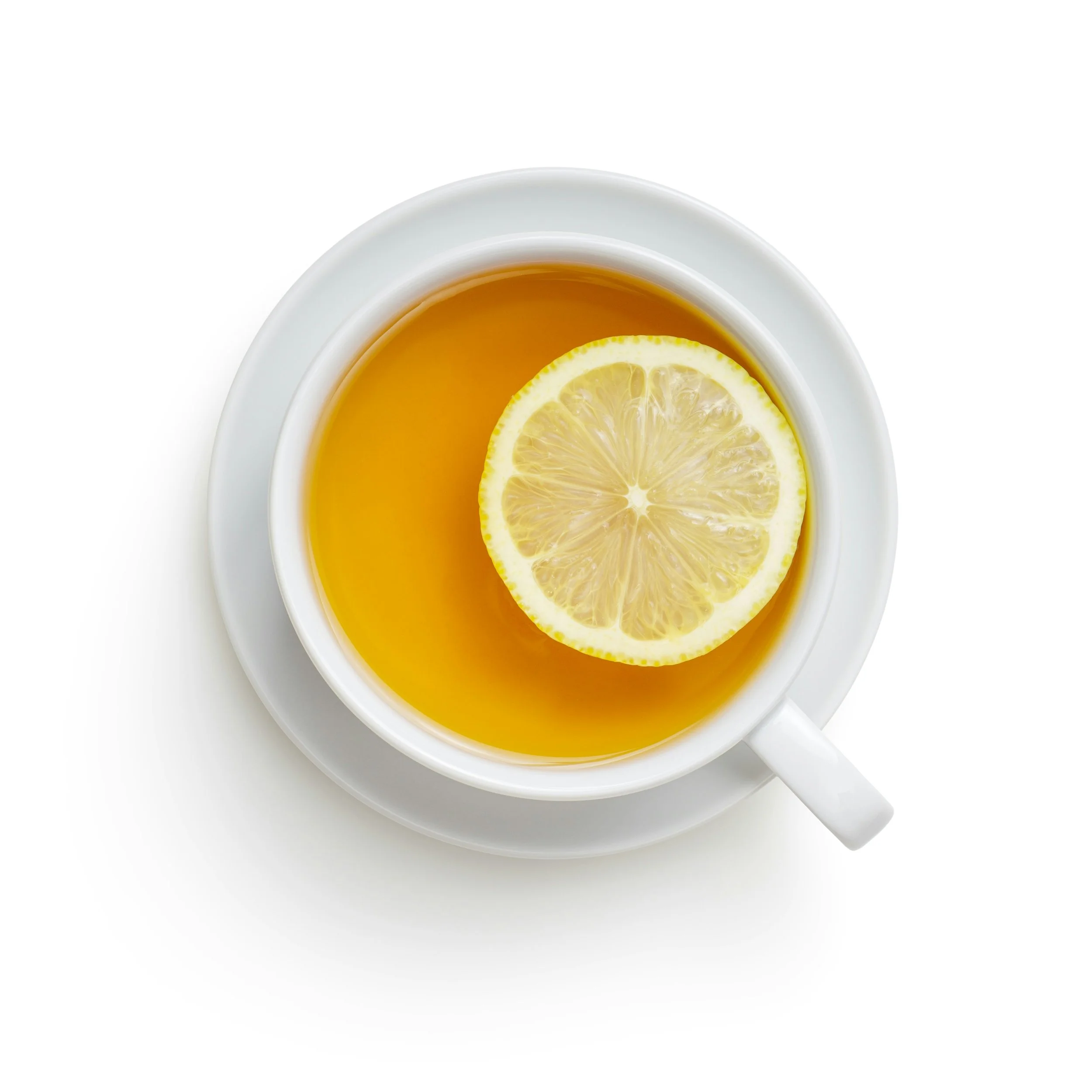 A cup of tea with a slice of lemon in it.