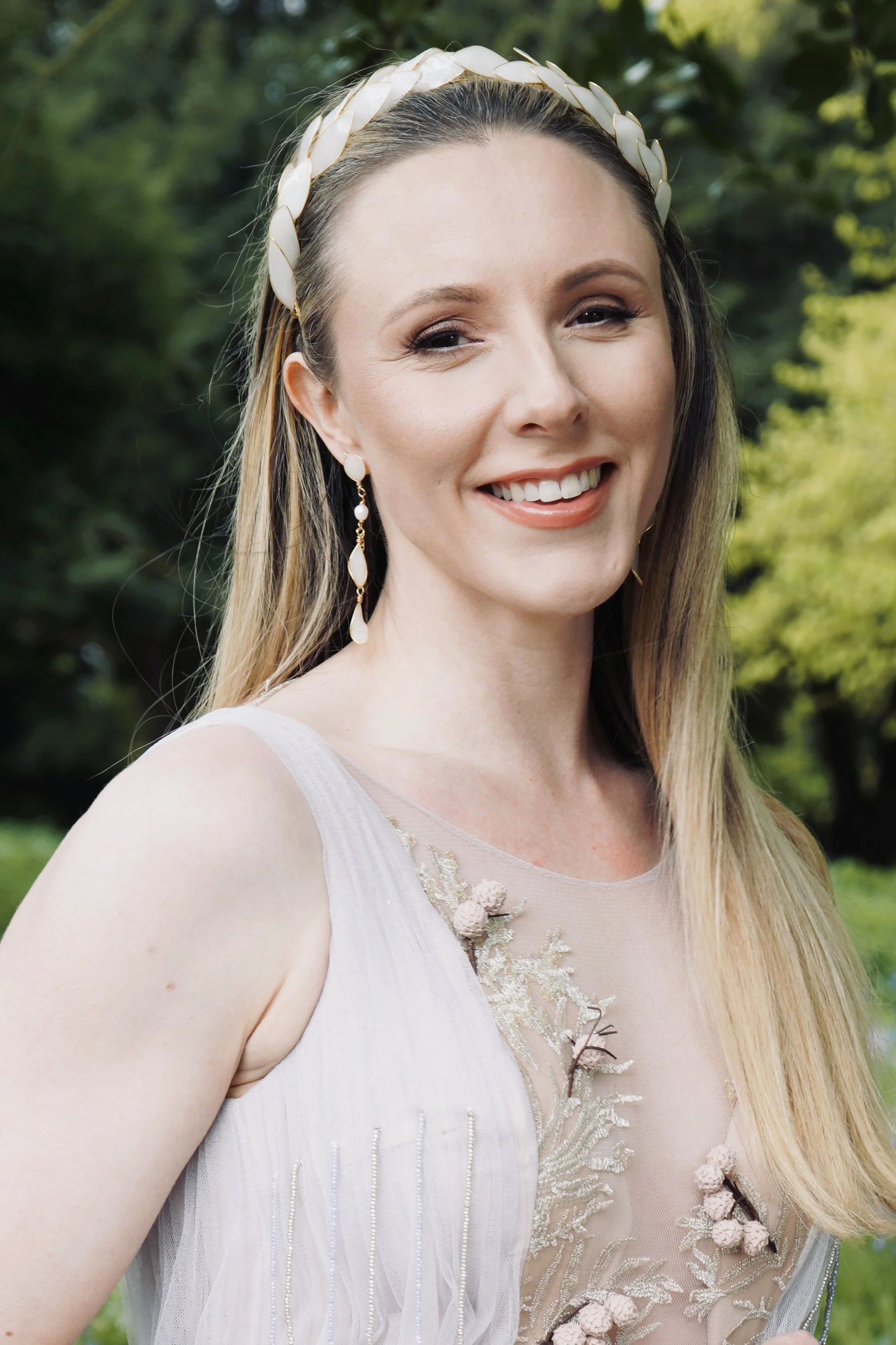 Elegant bride wearing a handcrafted bridal tiara and pearl earrings by Jen Gilbert