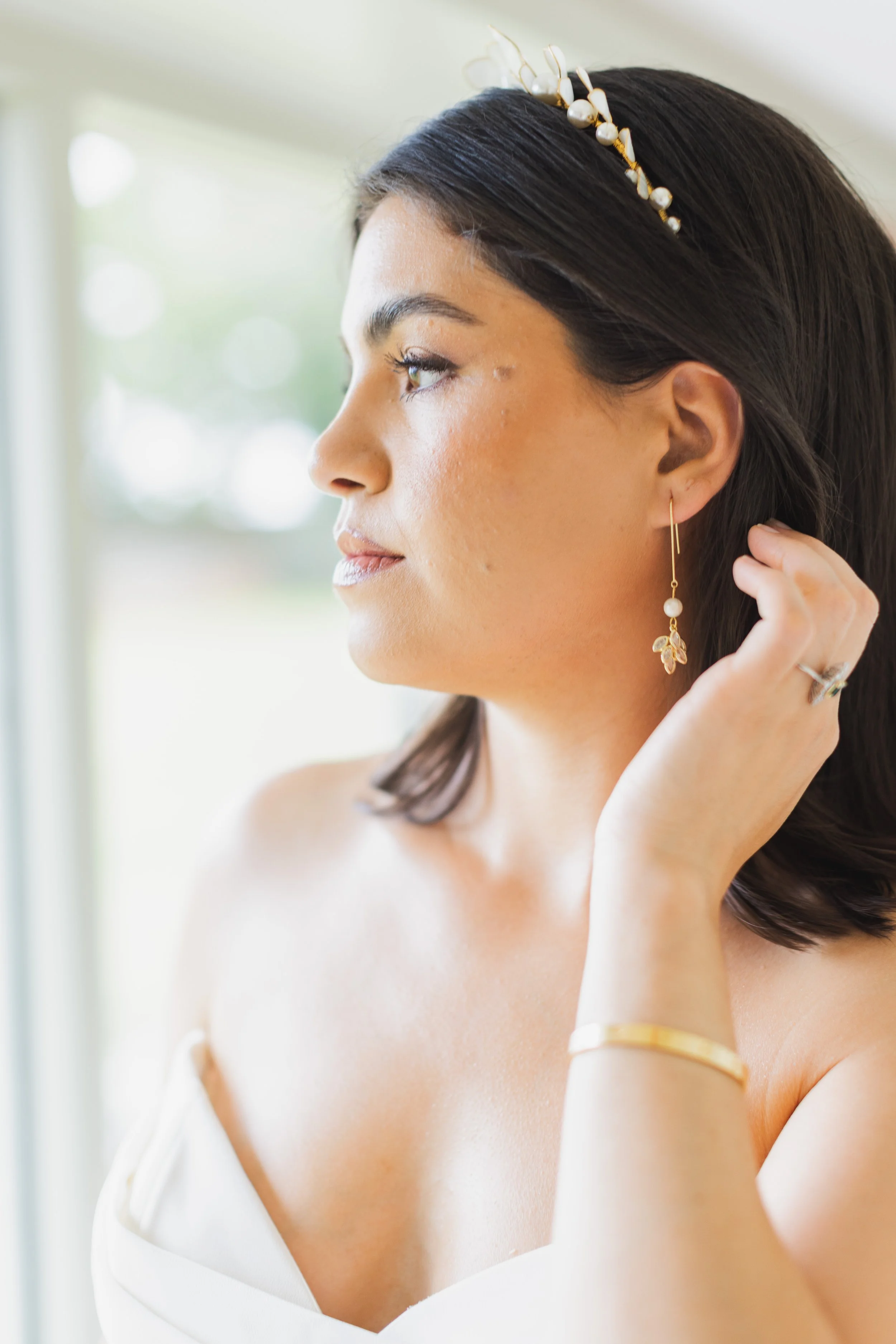 Modern bride wearing luxury bridal hair accessories and jewellery by UK designer Jen Gilbert