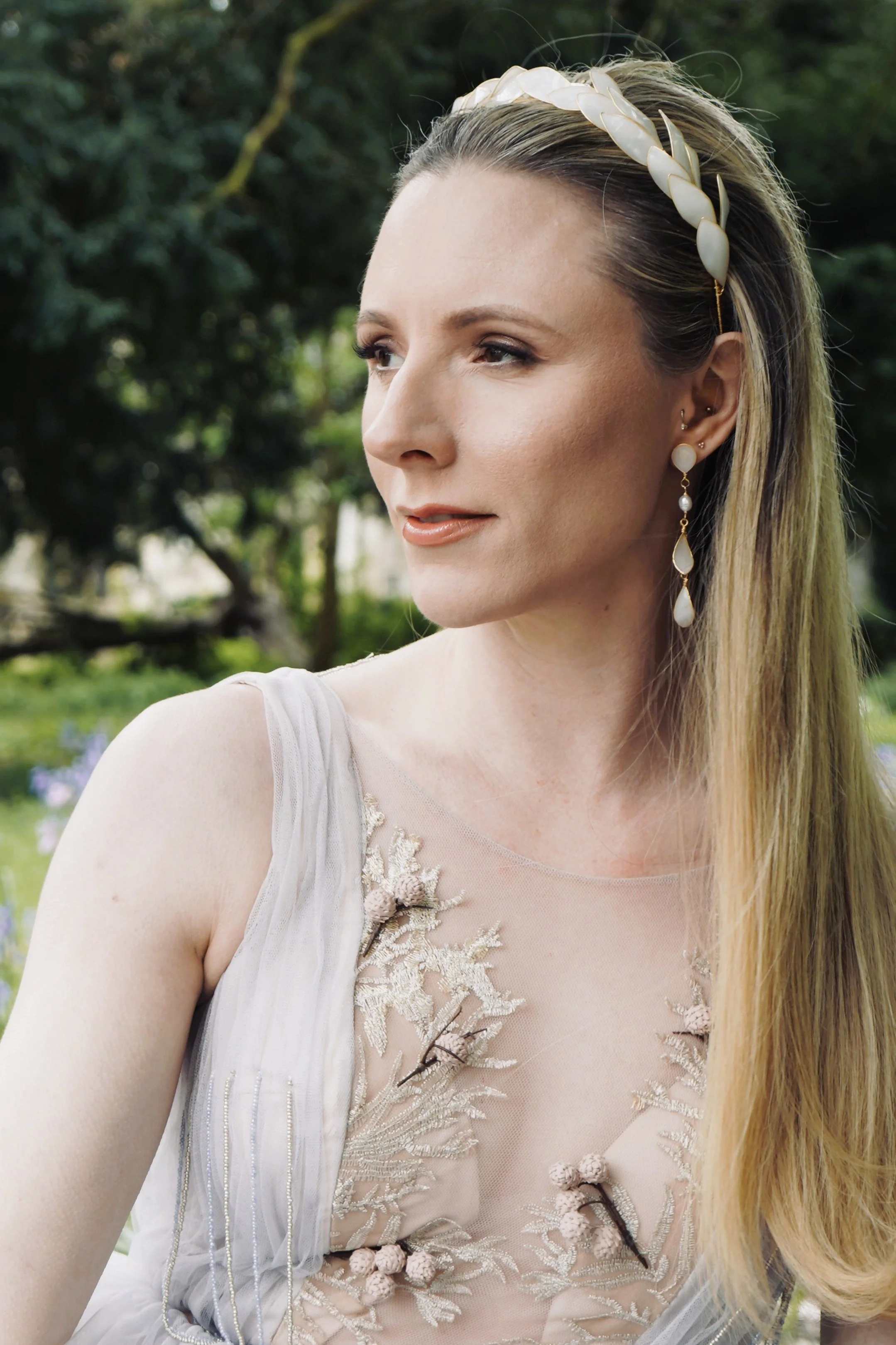 Elegant bride wearing a handcrafted bridal tiara and pearl earrings by Jen Gilbert