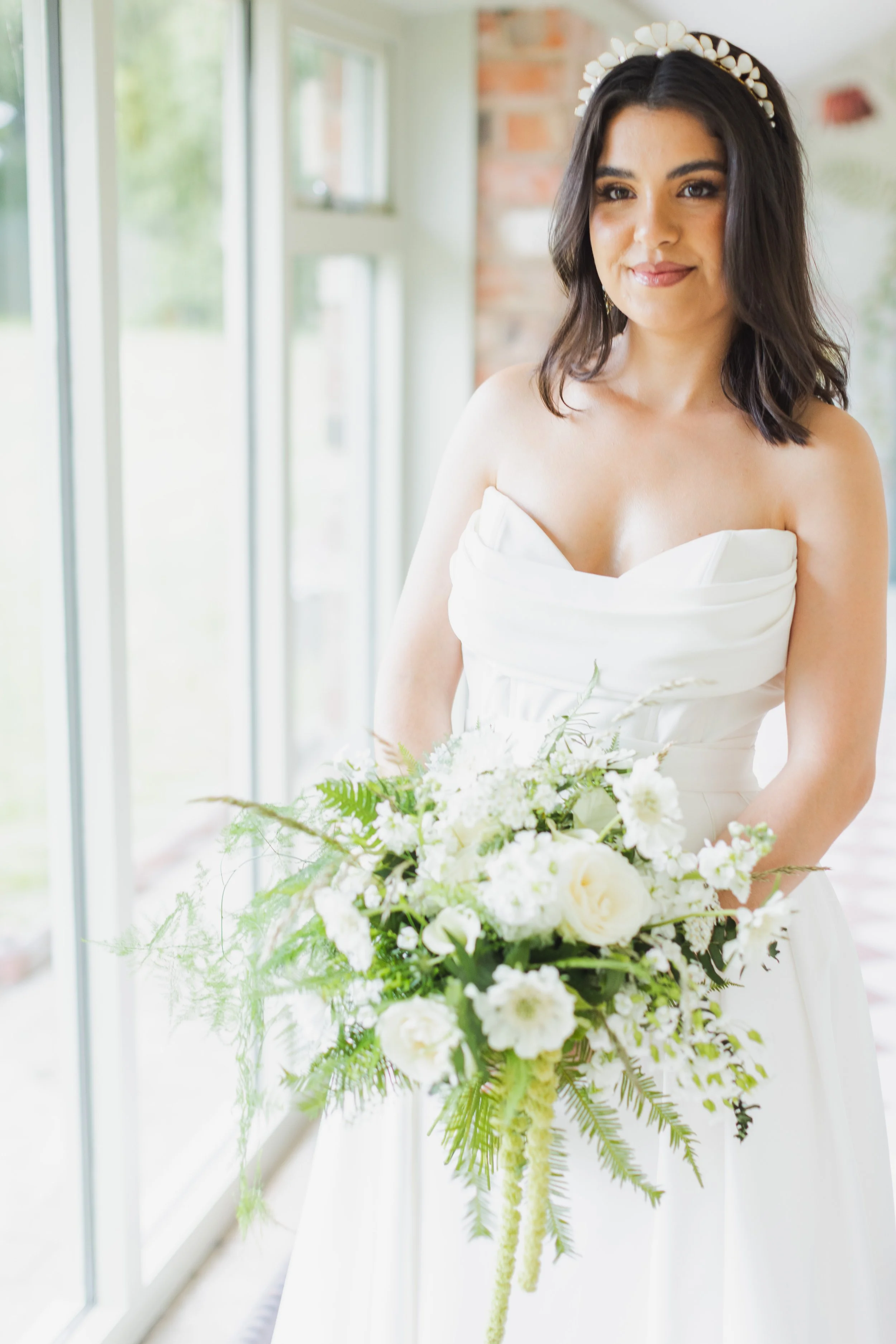 Modern bride wearing luxury bridal hair accessories and jewellery by UK designer Jen Gilbert
