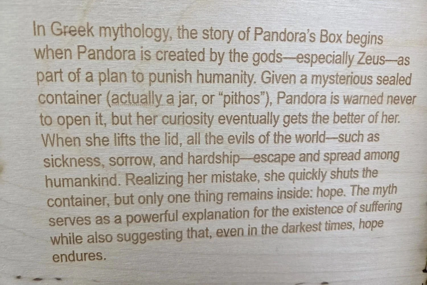 The inside cover of this laser-engraved wooden box includes the story of Pandora's Box.
