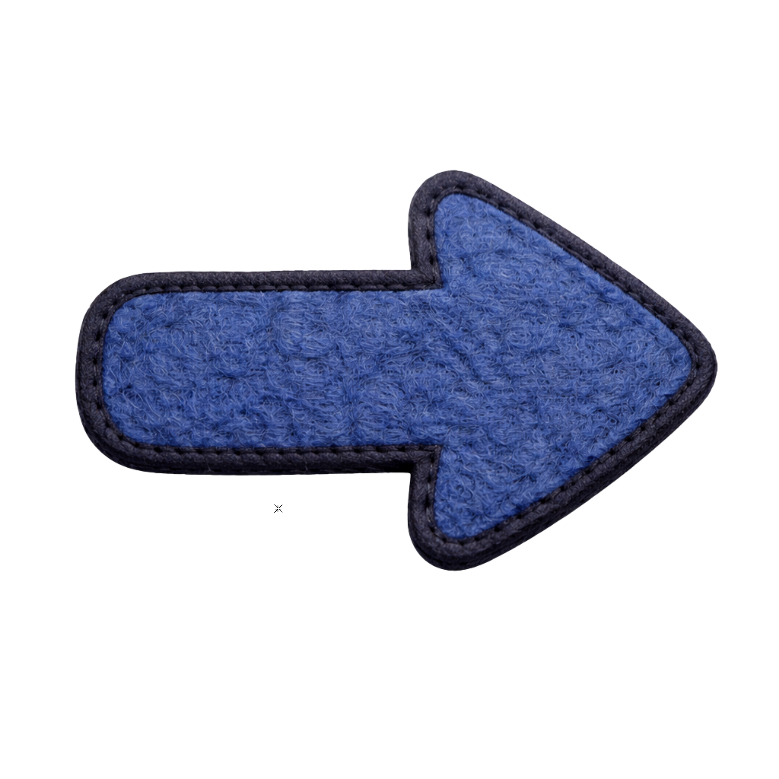Blue fabric patch in the shape of a right arrow with black stitching border.