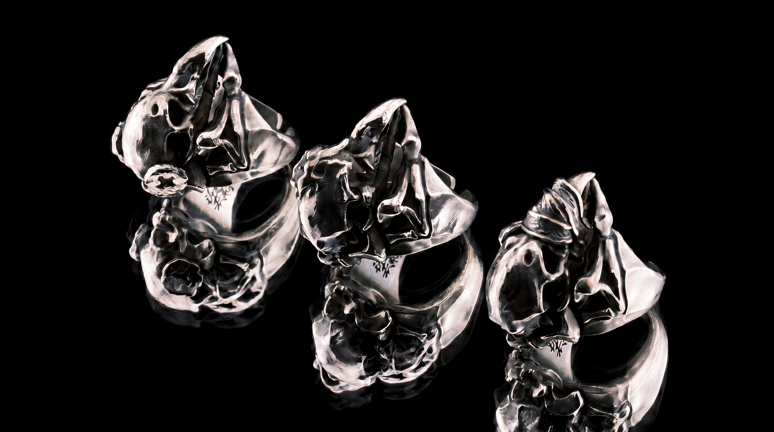 Liangshui Forge Three No Birds Triad Set - Lying on mirrored surface, Silent Echo, Unseeing Gaze, Muted Beak left to right