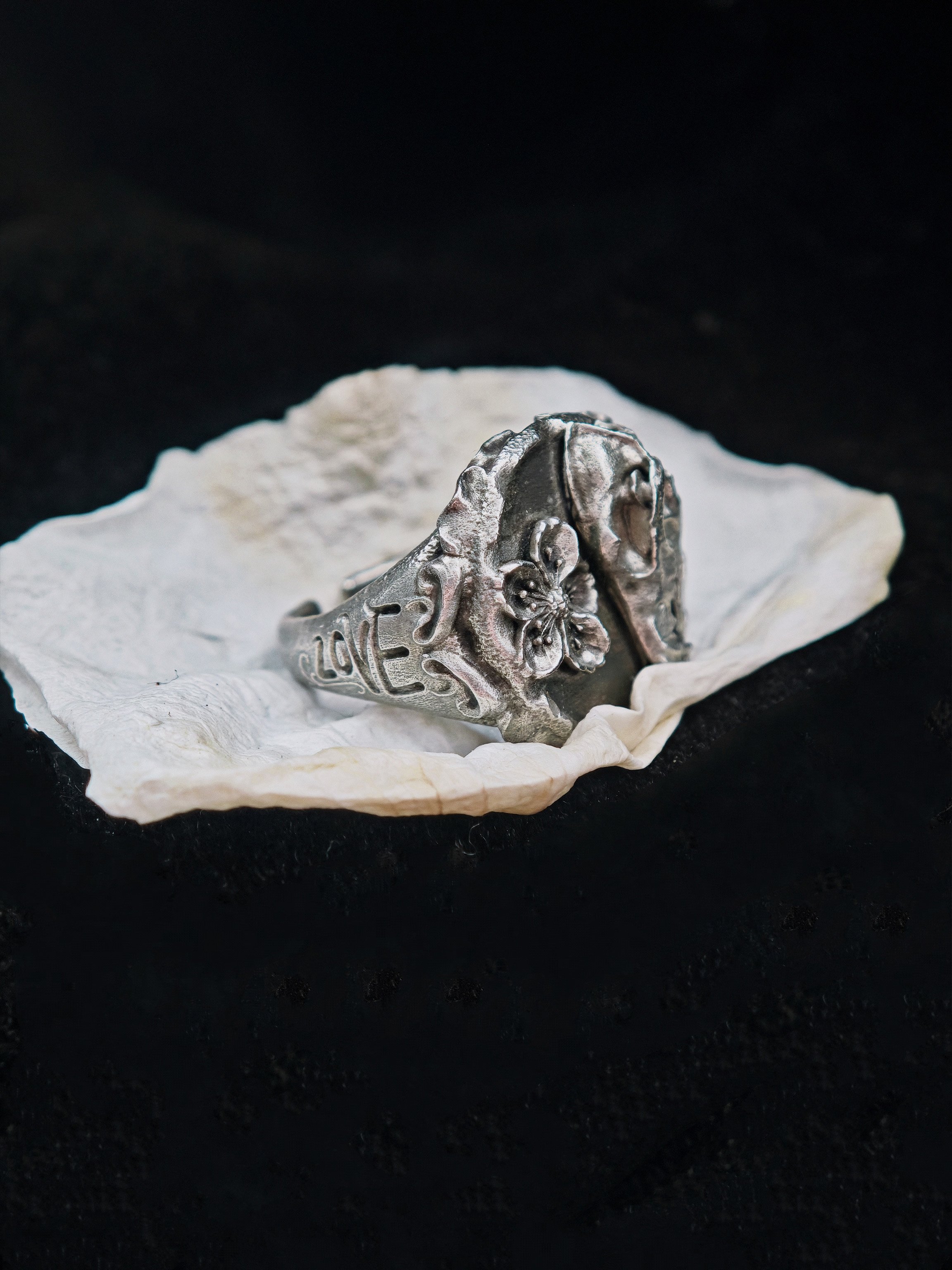 DHG W1 Signet Ring - Angled side view showing LOVE engraving on the band flank