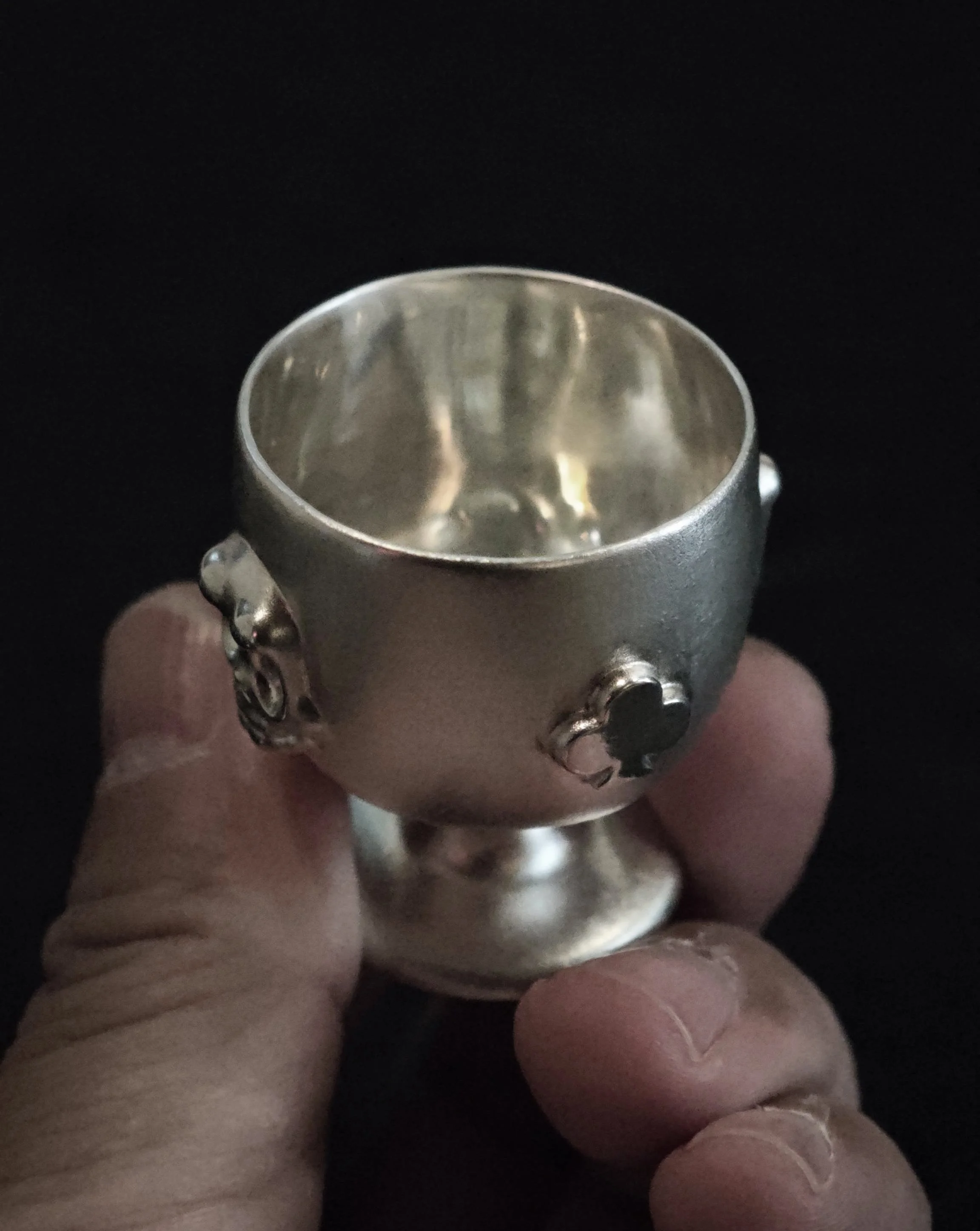 Xia Penghao BONE BUD CLUB CUP - Handheld overhead view showing interior and relief details