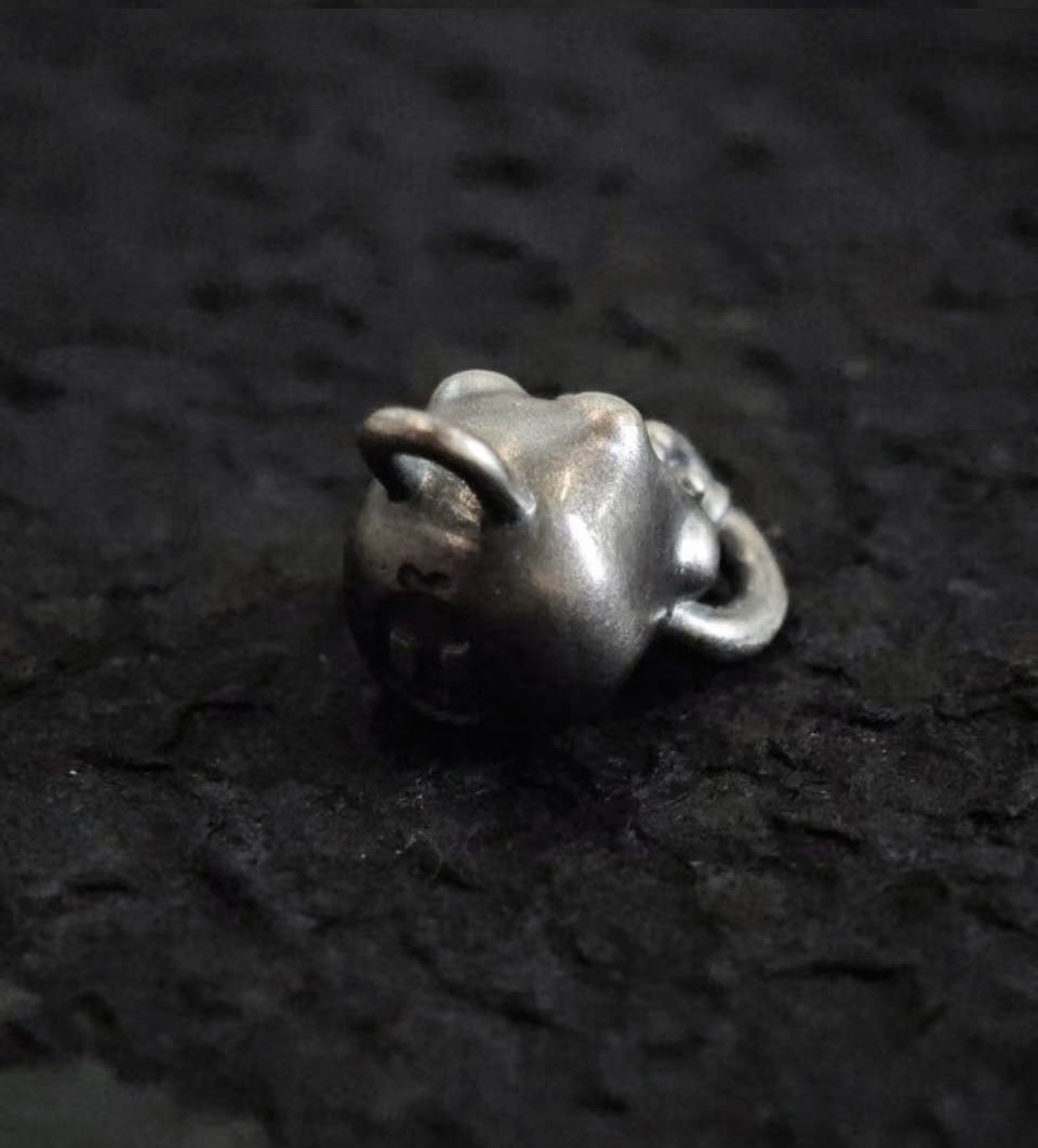 Xia Penghao BONE BUD THREE SENSES GAG Pendant - Rear overhead angle showing BONE BUD skull logo