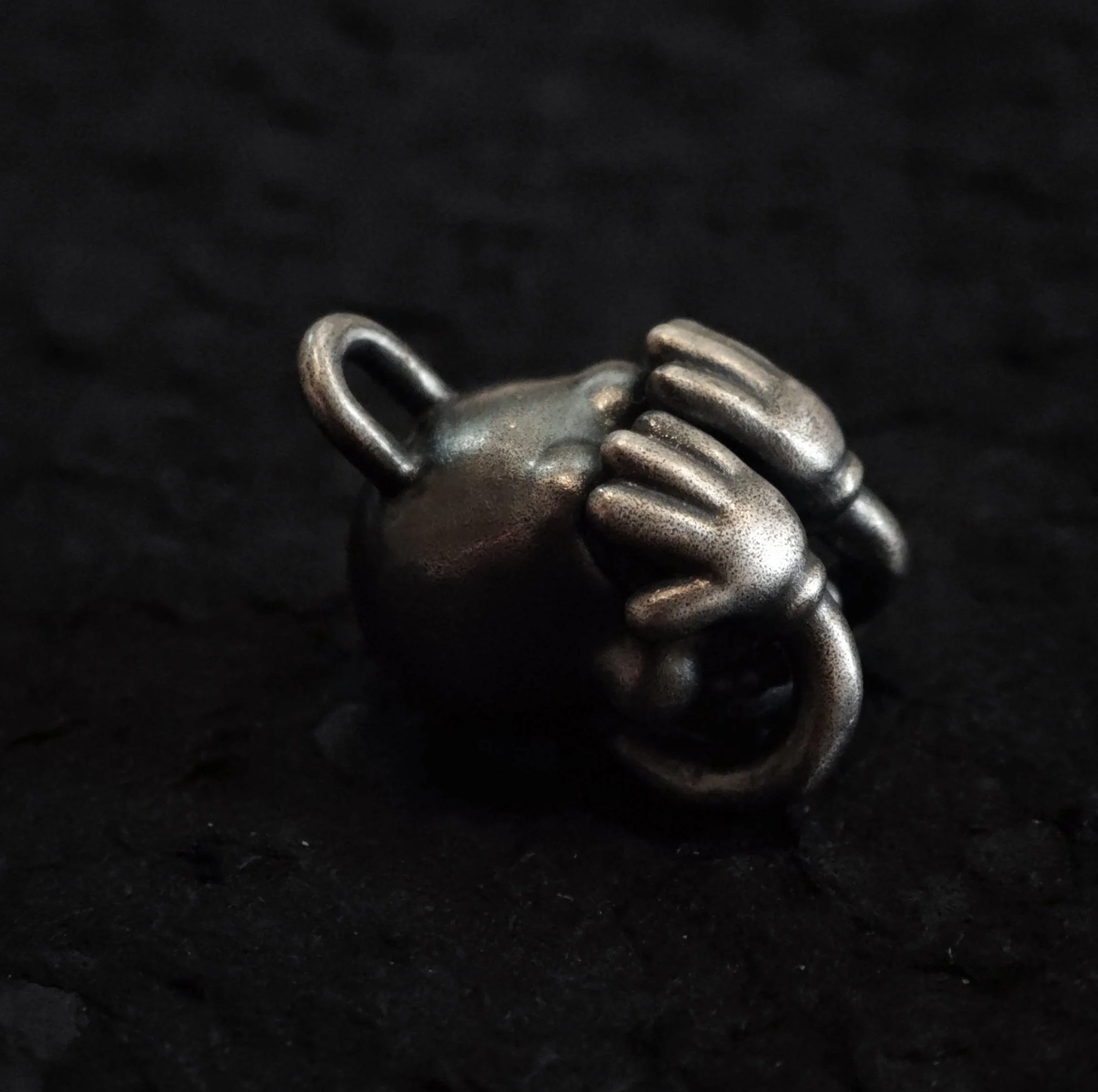 Xia Penghao BONE BUD THREE SENSES VEIL Pendant - Angled side profile on tabletop