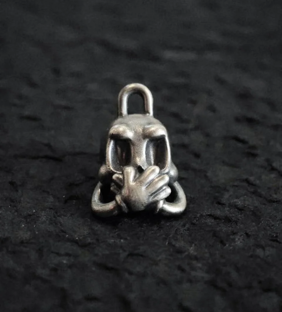 Xia Penghao BONE BUD THREE SENSES GAG Pendant - Flat lay front view showing hands covering mouth
