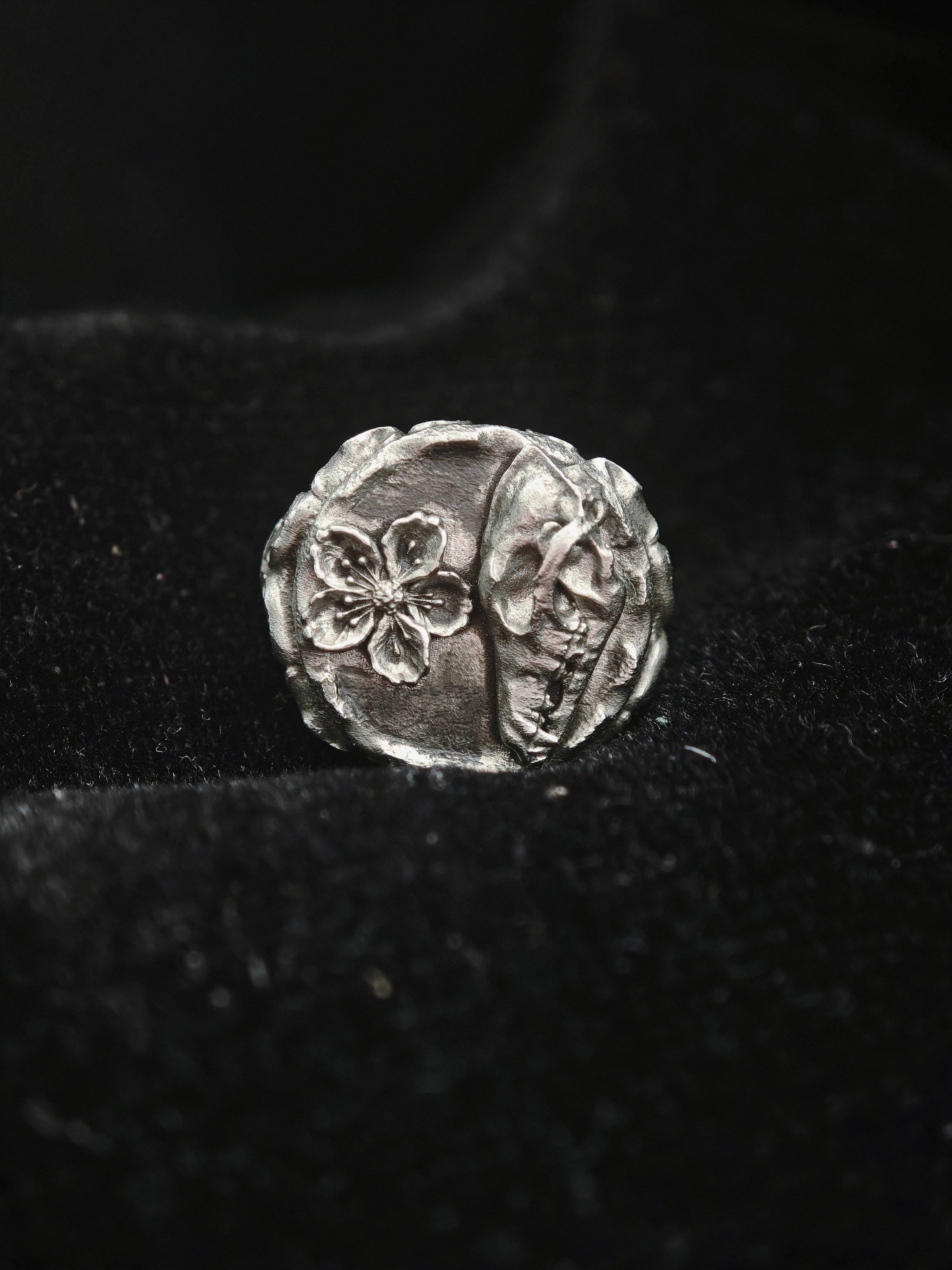 DHG W1 Signet Ring - Tabletop view showing Guardian Hound and Peach Blossom face detail