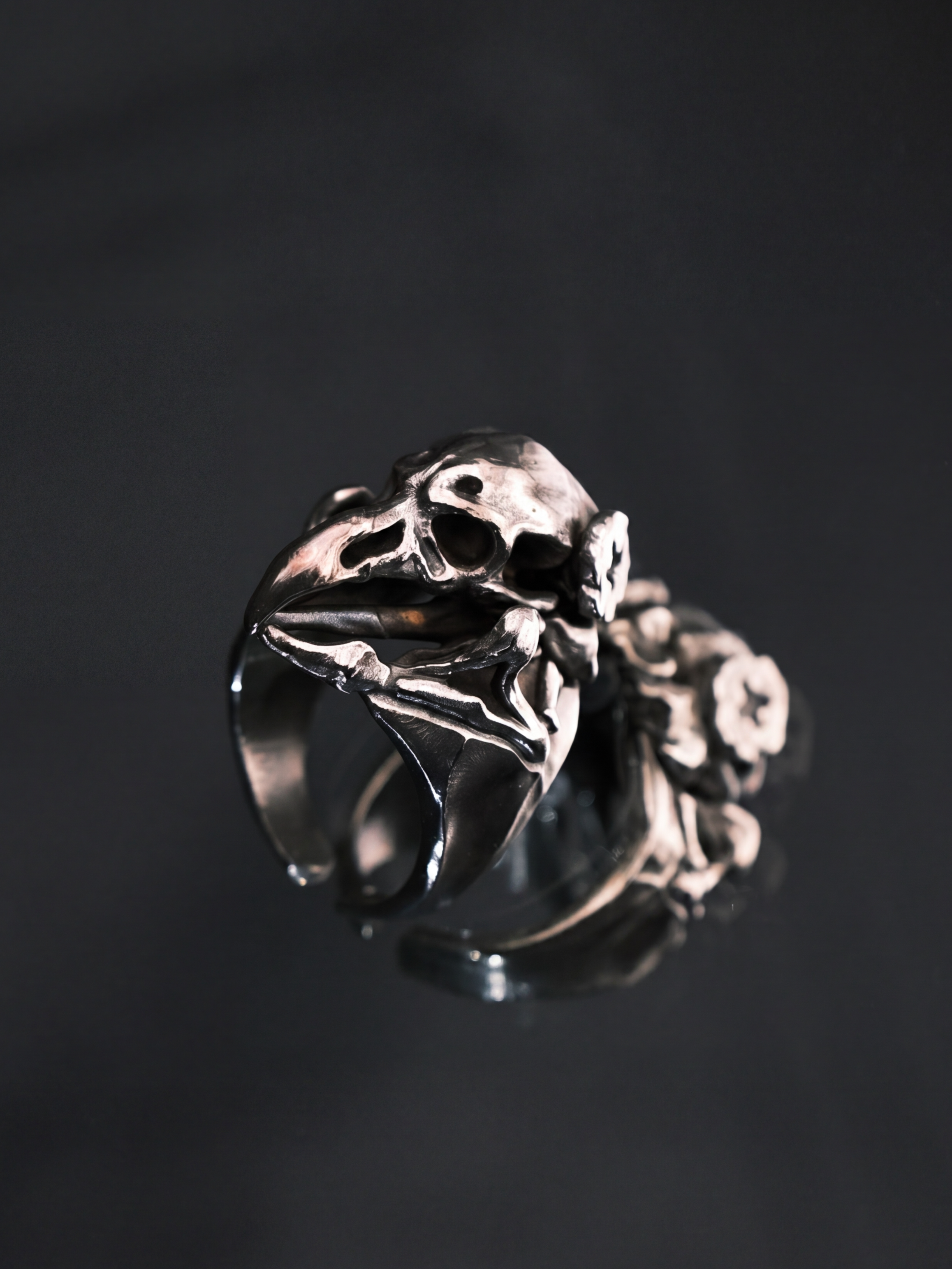 Liangshui Forge Three No Birds Silent Echo Ring - On mirrored surface, close side view showing sculptural detail