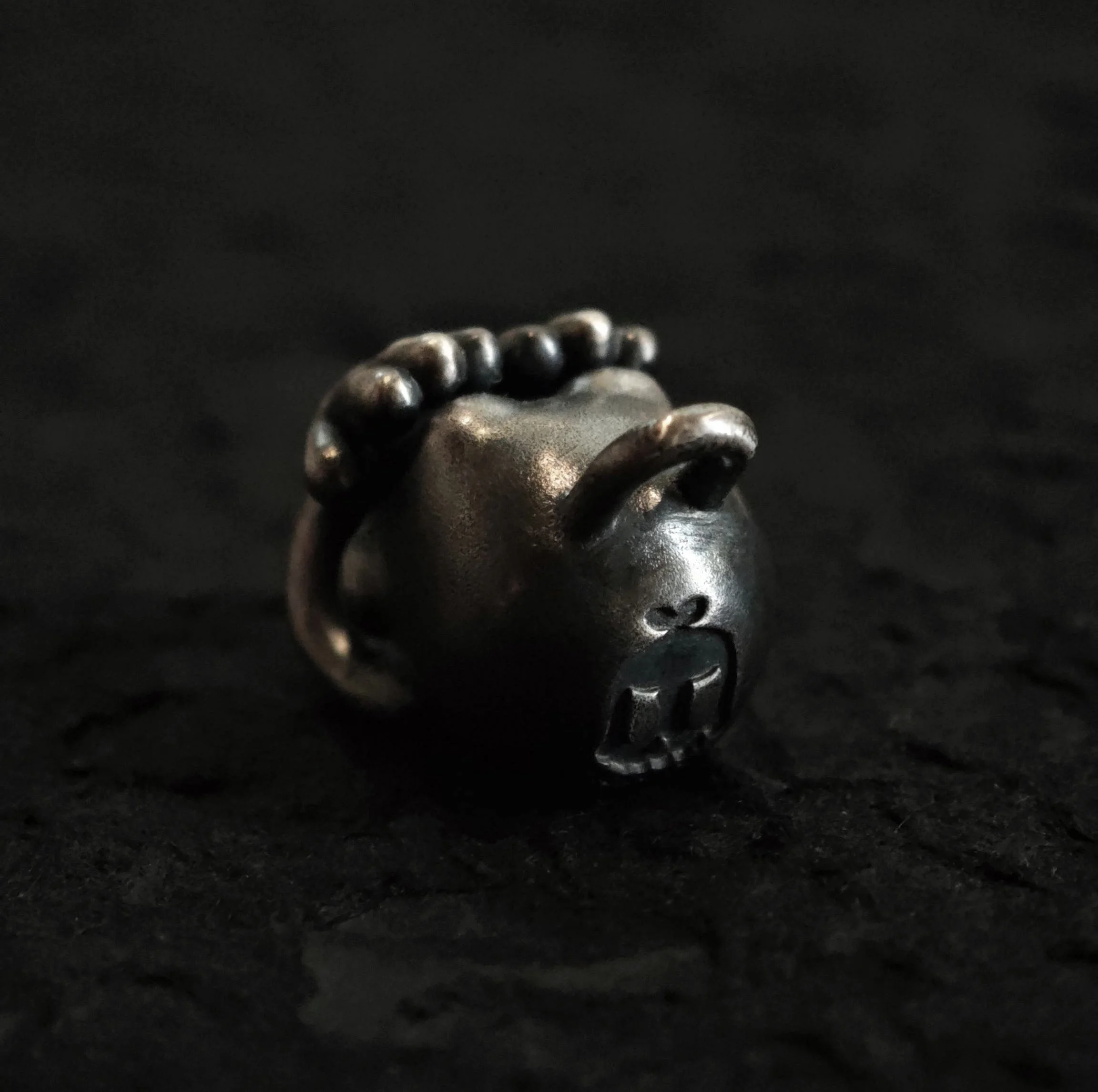 Xia Penghao BONE BUD THREE SENSES VEIL Pendant - Rear angle showing BONE BUD skull logo on back