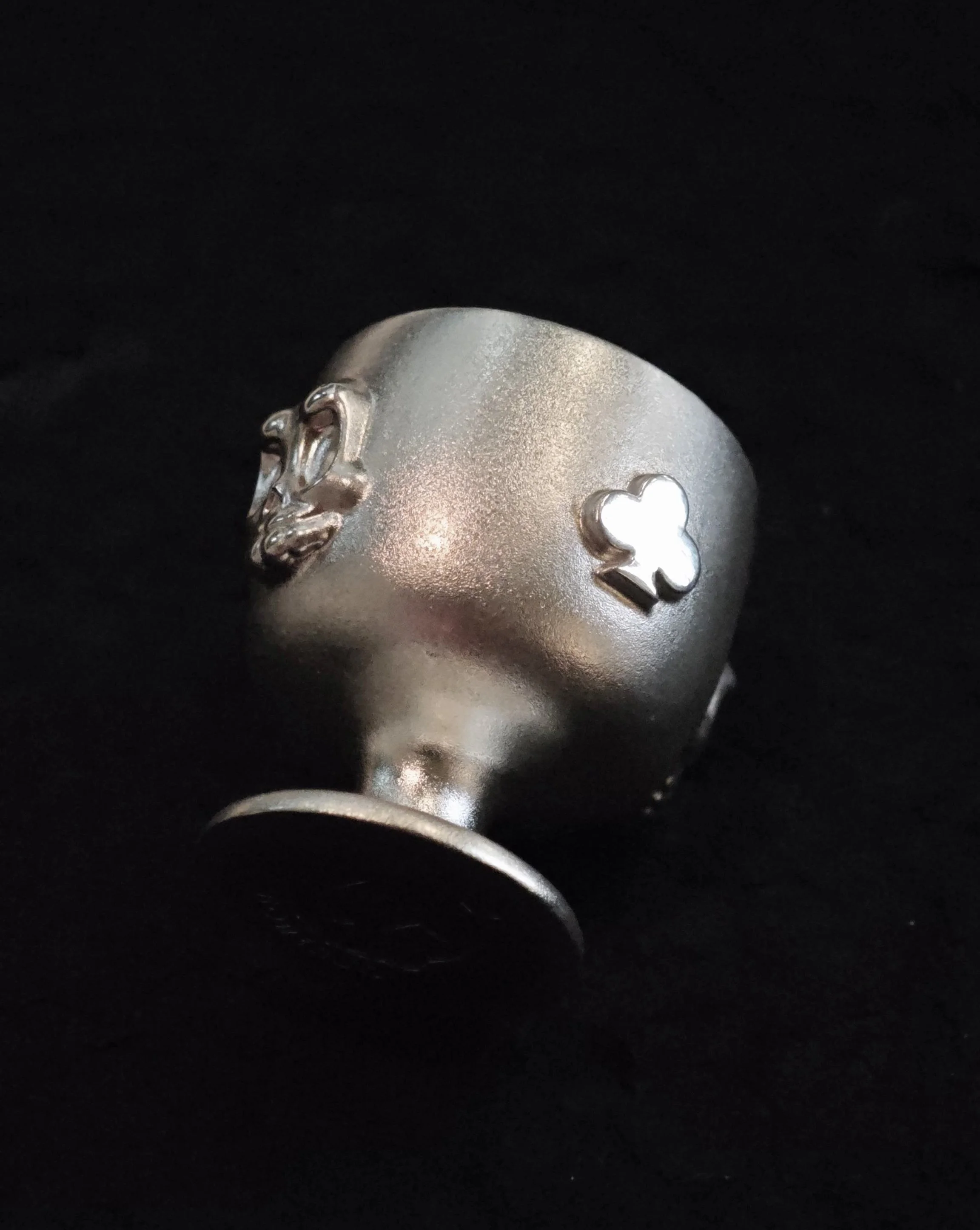 Xia Penghao BONE BUD CLUB CUP - Tabletop view showing detailed club and skull relief motifs