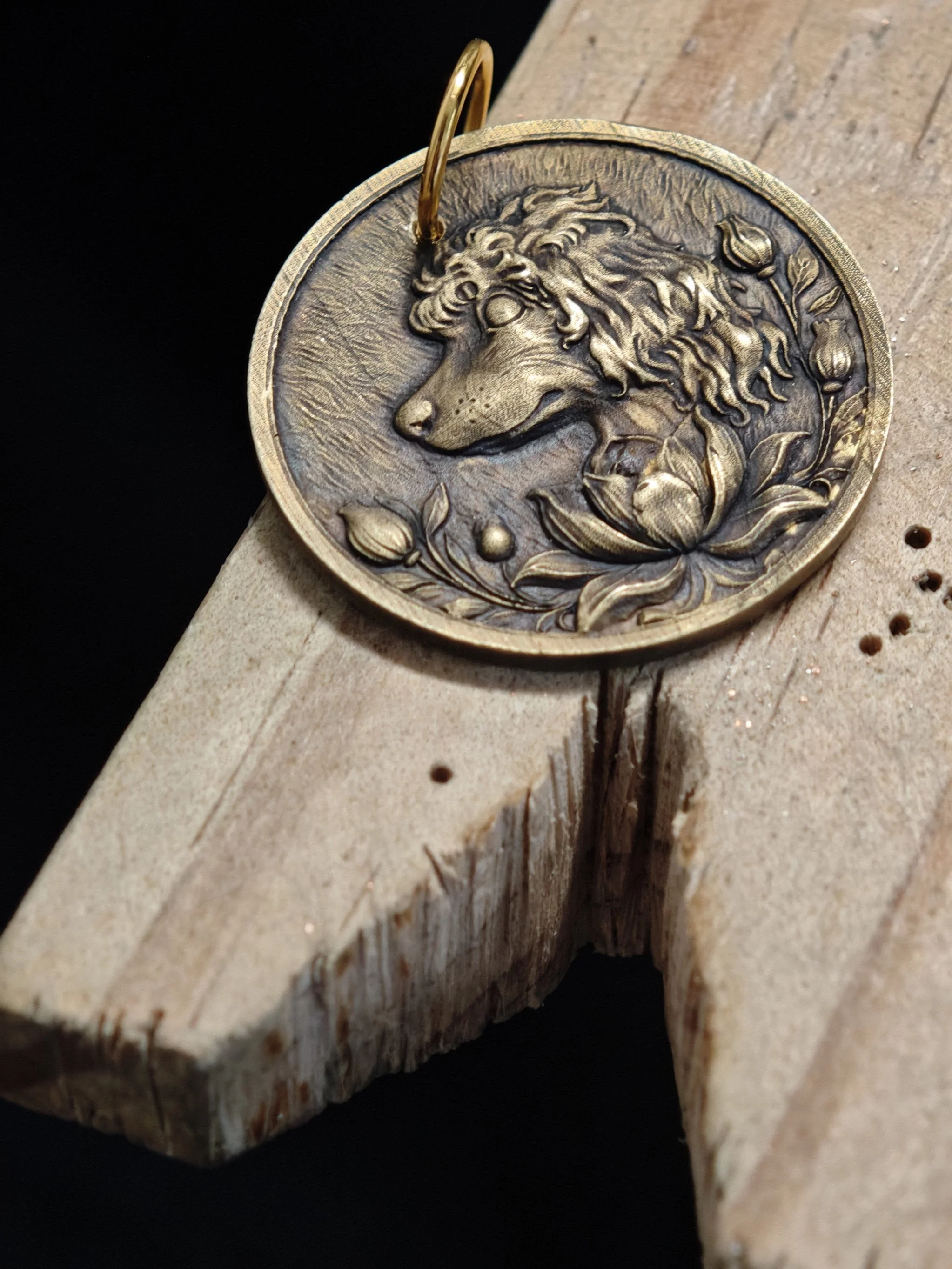 DHG Y1 You Qing You Diao Medallion - Front view on jeweler's bench peg