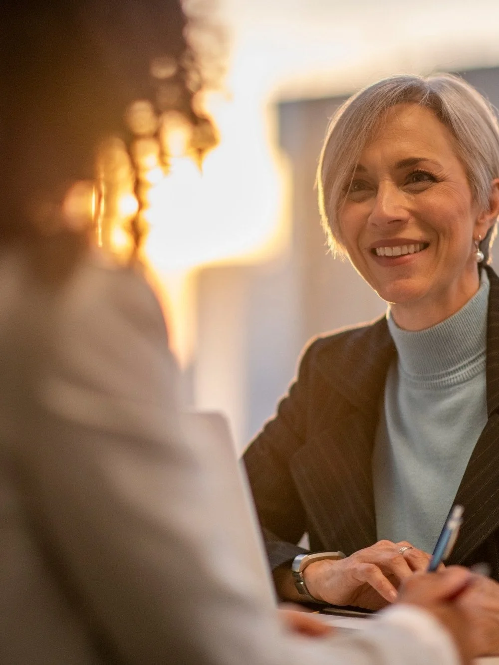Female tax professional while discussing with a client.