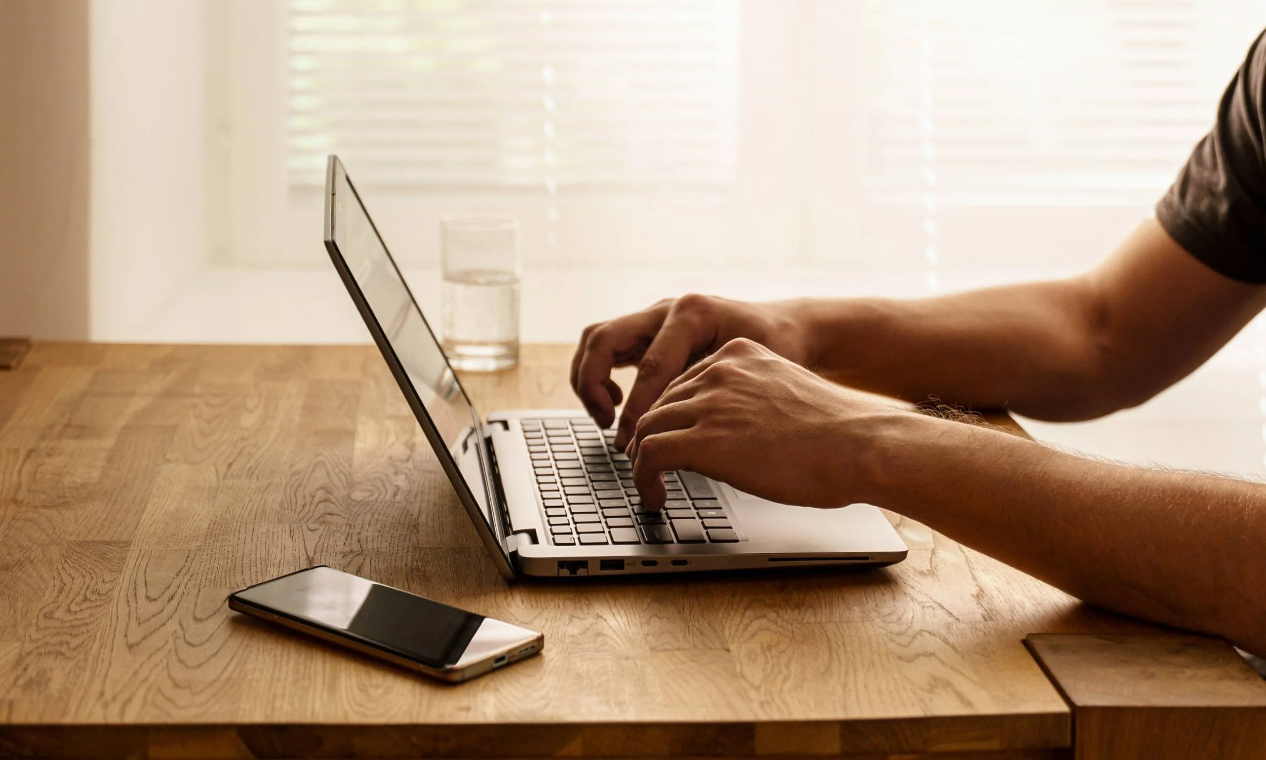 Tax coach working on his laptop.