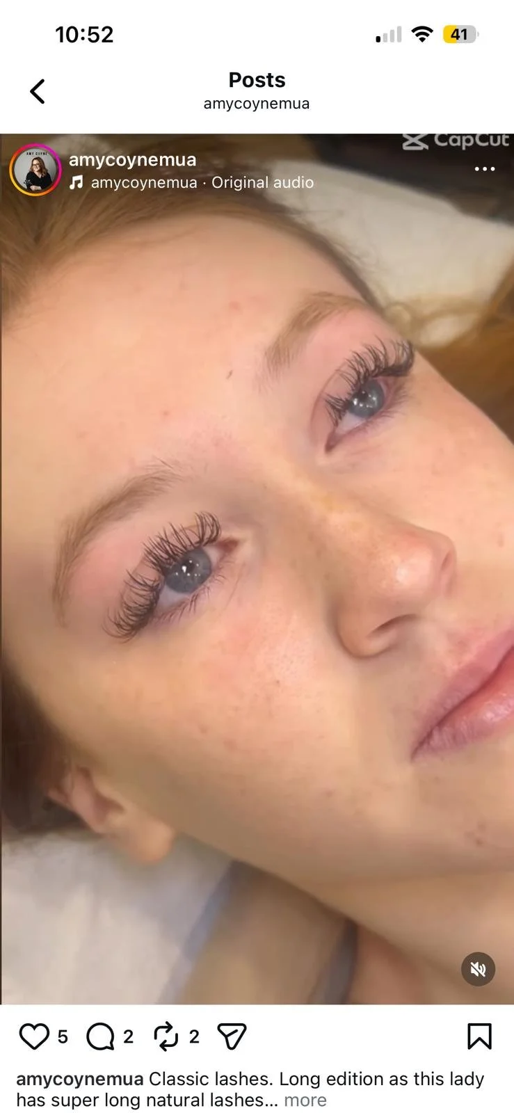 Close-up of a woman's face showing her eyes with long, natural eyelashes.