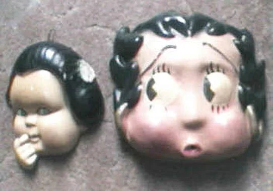 1930s String Holders – There were several varieties of these, all made of chalkware. The lips are red for both styles, with an opening to feed the string through. Manufacturer unknown. Rare. NOTE: Since it is easy to make a mold of these items, be su