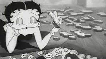  Betty works on a jigsaw puzzle in "Betty in Blunderland"  