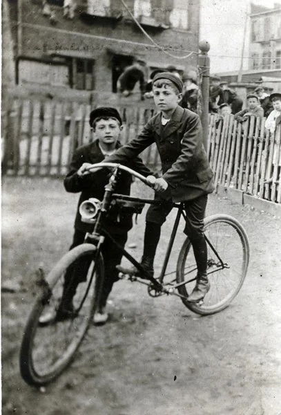 Max Fleischer on bike and brother, Charlie, standing. They were known in their neighborhood doing bike tricks. Circa 1893. The Fleischer Family Collection
