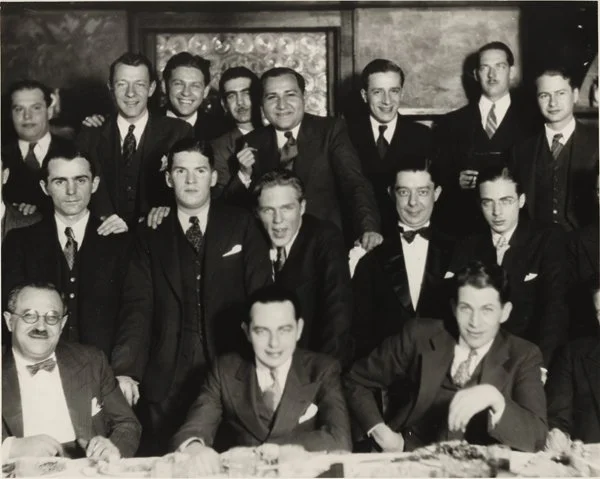 A bachelor dinner for Seymour Kneitel with Fleischer Studio staff. Likely Dec. 1932, New York. Seated left to right: Max Fleischer, Seymour Kneitel and Roland Crandall. Standing: Frank Paiker, Willard Bowsky, Al Eugster, Ugo D’Orsi, Reuben Timinsky B