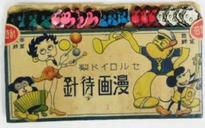The packaging for these push pins includes Betty Boop, Popeye and Mickey Mouse. You can see the tops of the pins above the package.