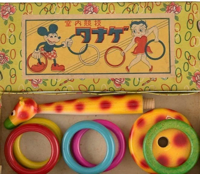 The game above is a ring toss game.